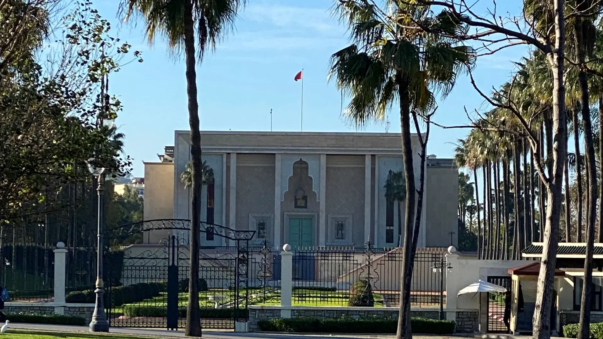 Palms and Marshan Palace in Tangier sunlight