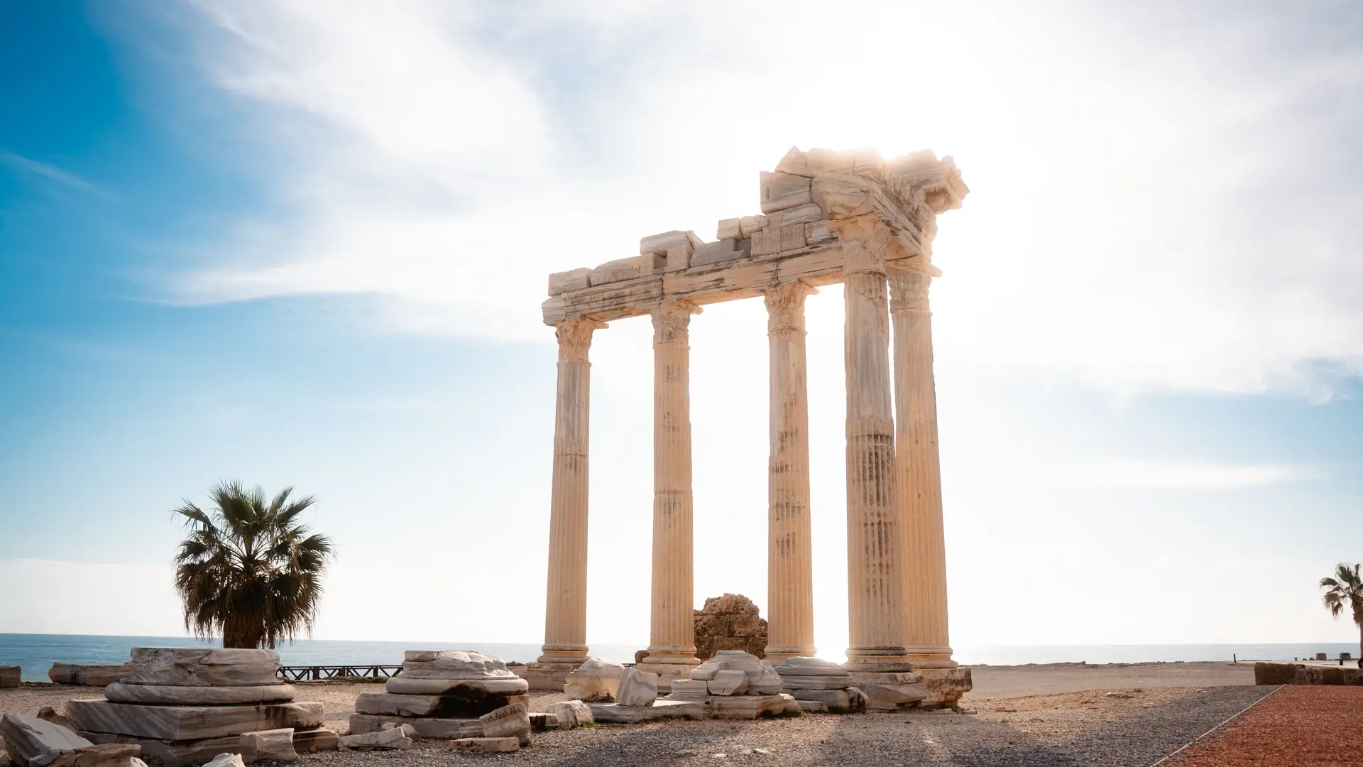 Temple of Apollo columns on Side waterfront glowing in sunshine above the blue Mediterranean