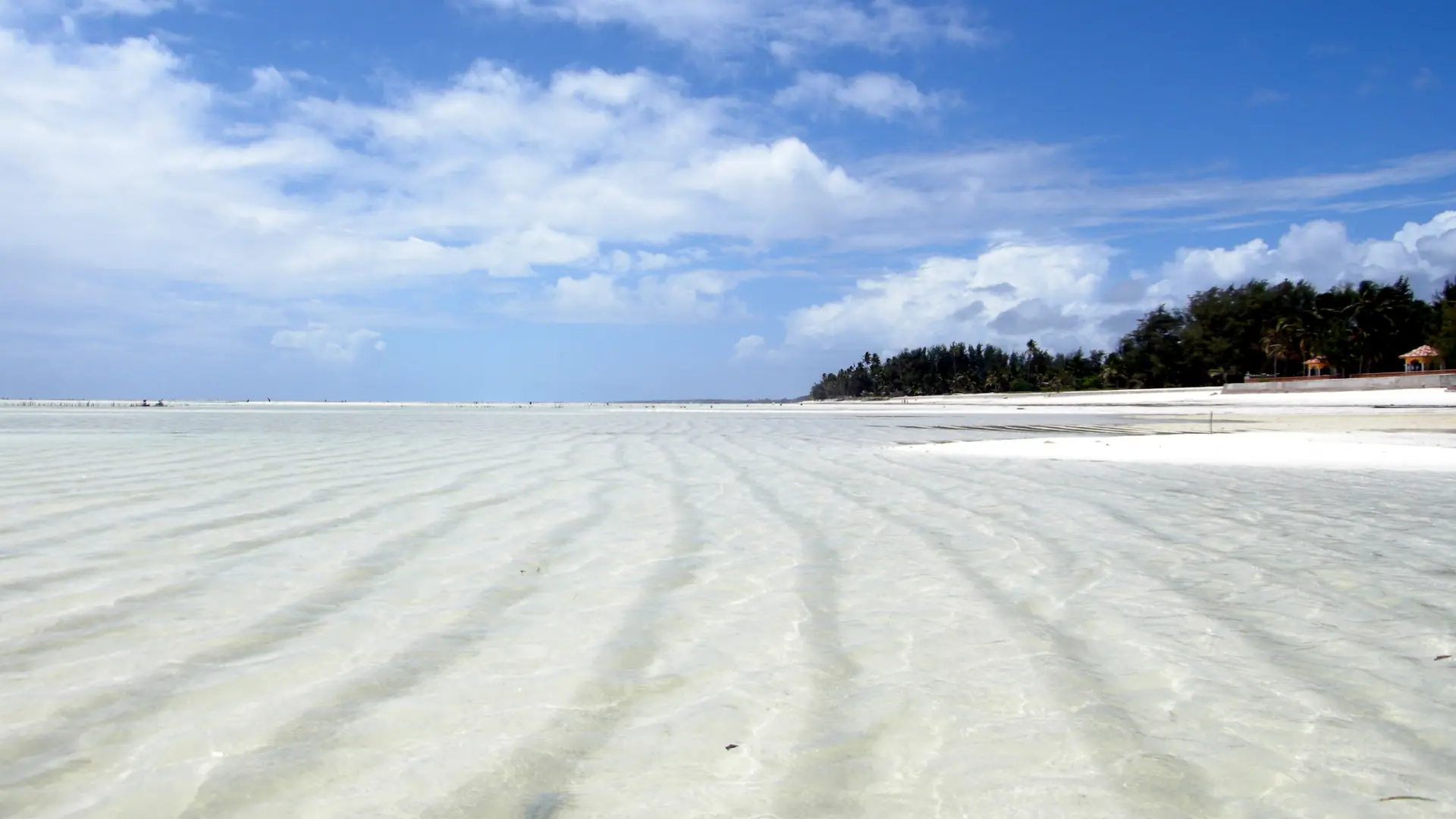 Paje east-coast beach in strong daylight with sand and blue water