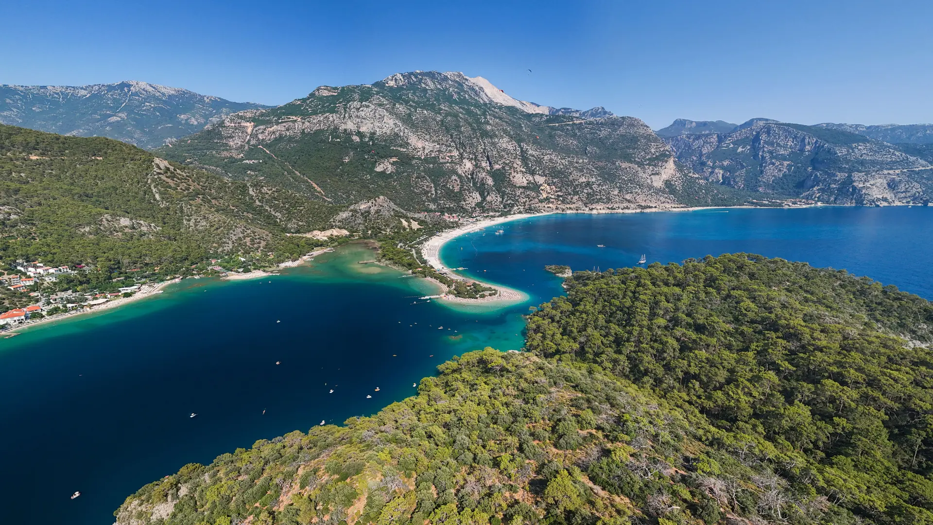 Turquoise Blue Lagoon at Ölüdeniz between pine-covered headlands