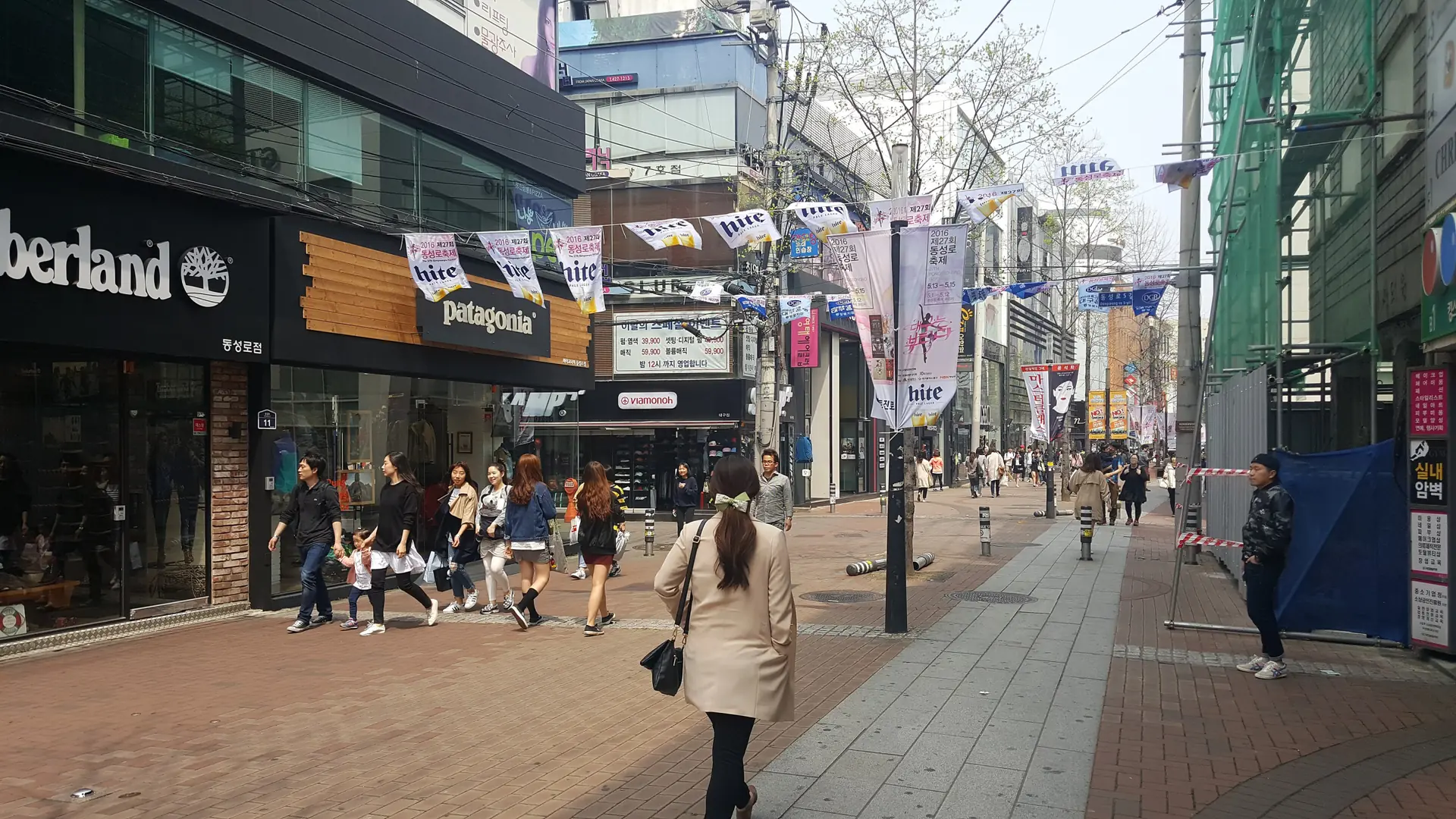 Pedestrians and shopfronts along Dongseongro in central Daegu in daylight