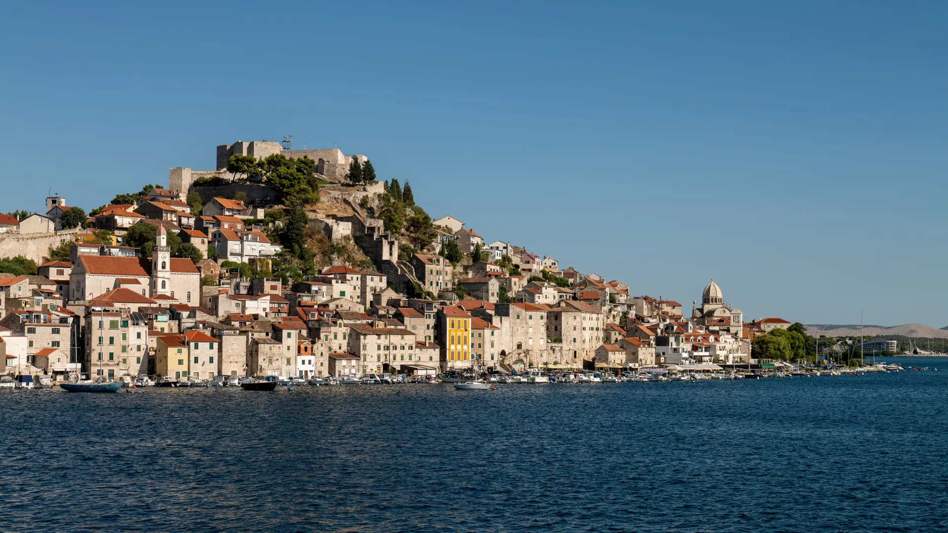 Šibenik’s historic waterfront and St Michael’s Fortress, shown as a wider city view