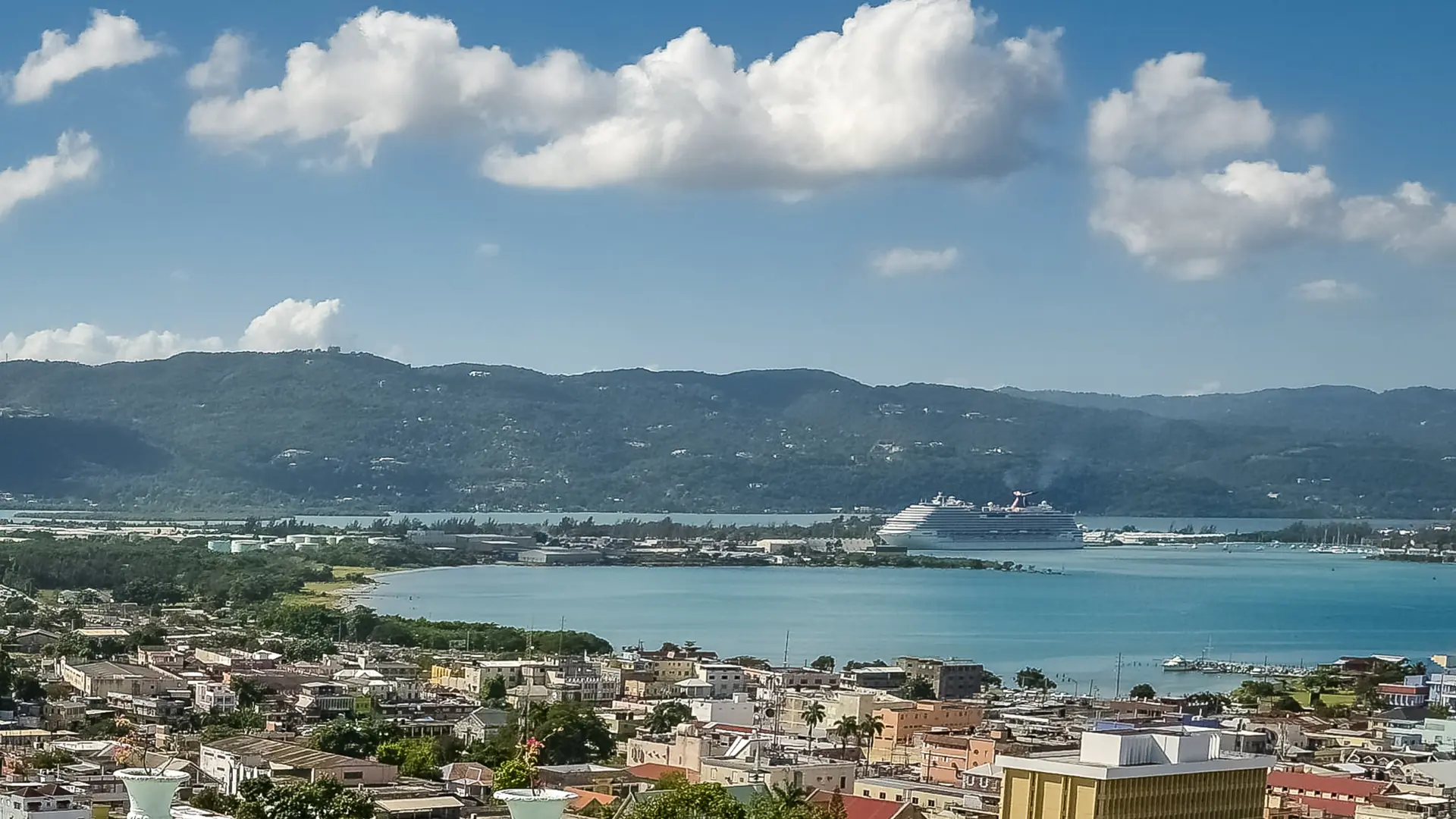 Montego Bay and its harbour with a cruise ship and the surrounding hills