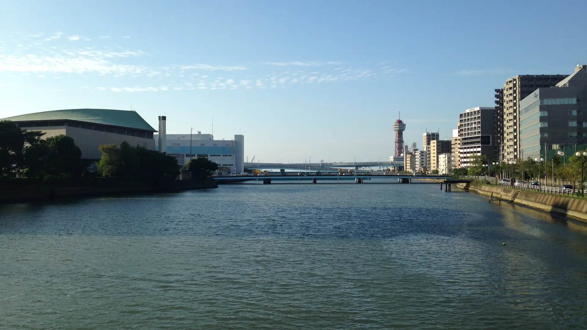 The Nakagawa River and distant red Hakata Port Tower in sunny Fukuoka