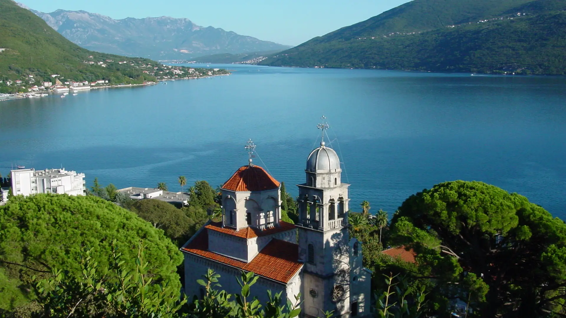 Savina Monastery on a green hillside overlooking the Bay of Kotor