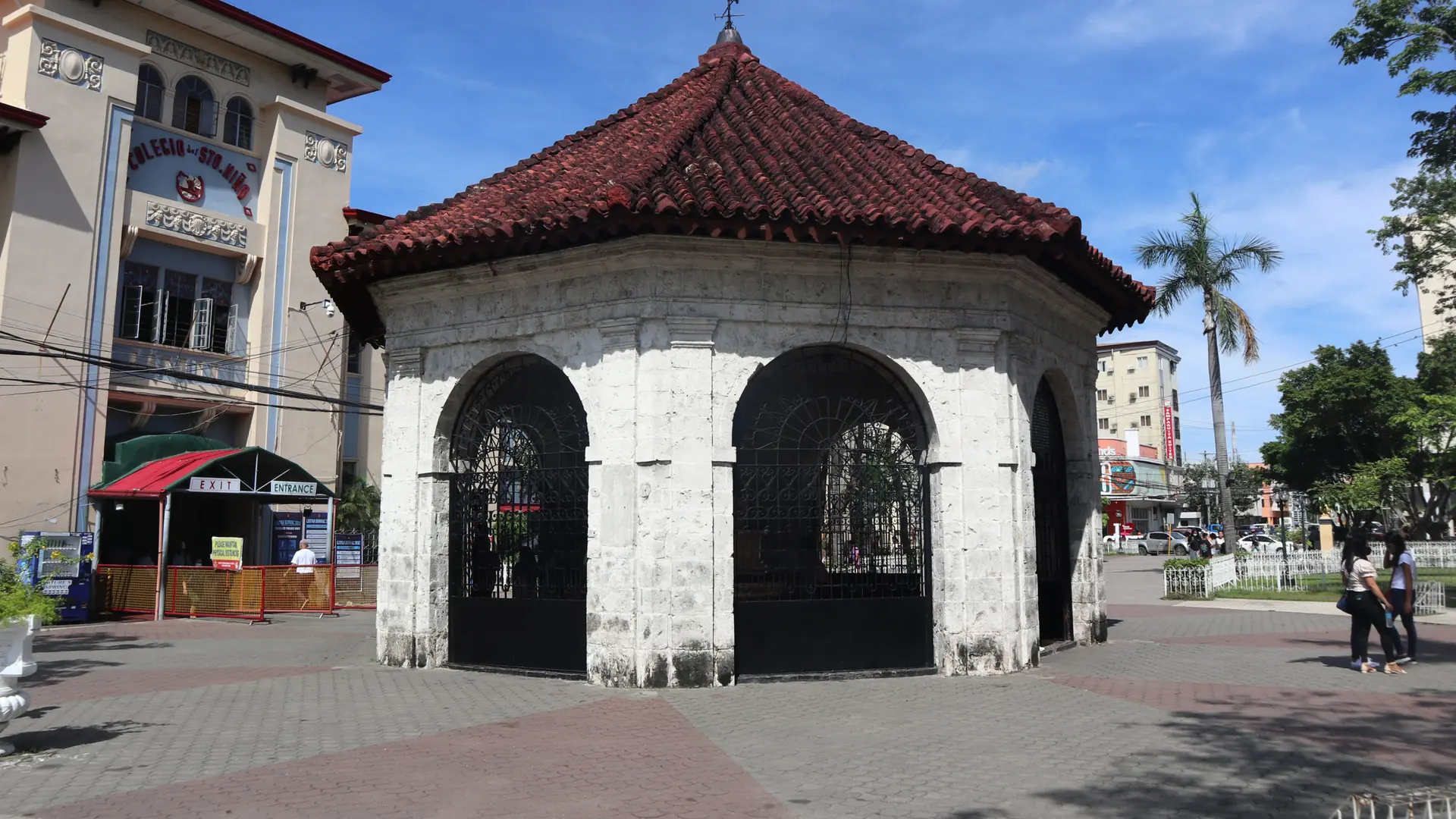 The red-tiled pavilion over Magellan's Cross in downtown Cebu City on a sunny day