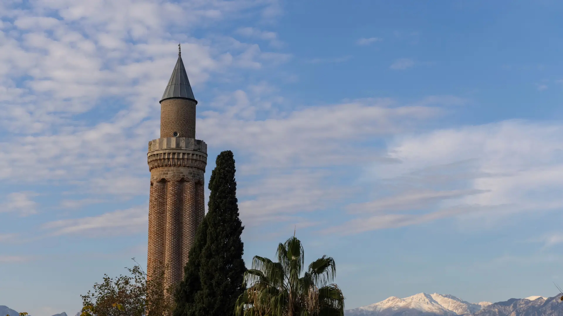 Antalya city centre rooftops and Yivli Minaret under a clear Mediterranean sky
