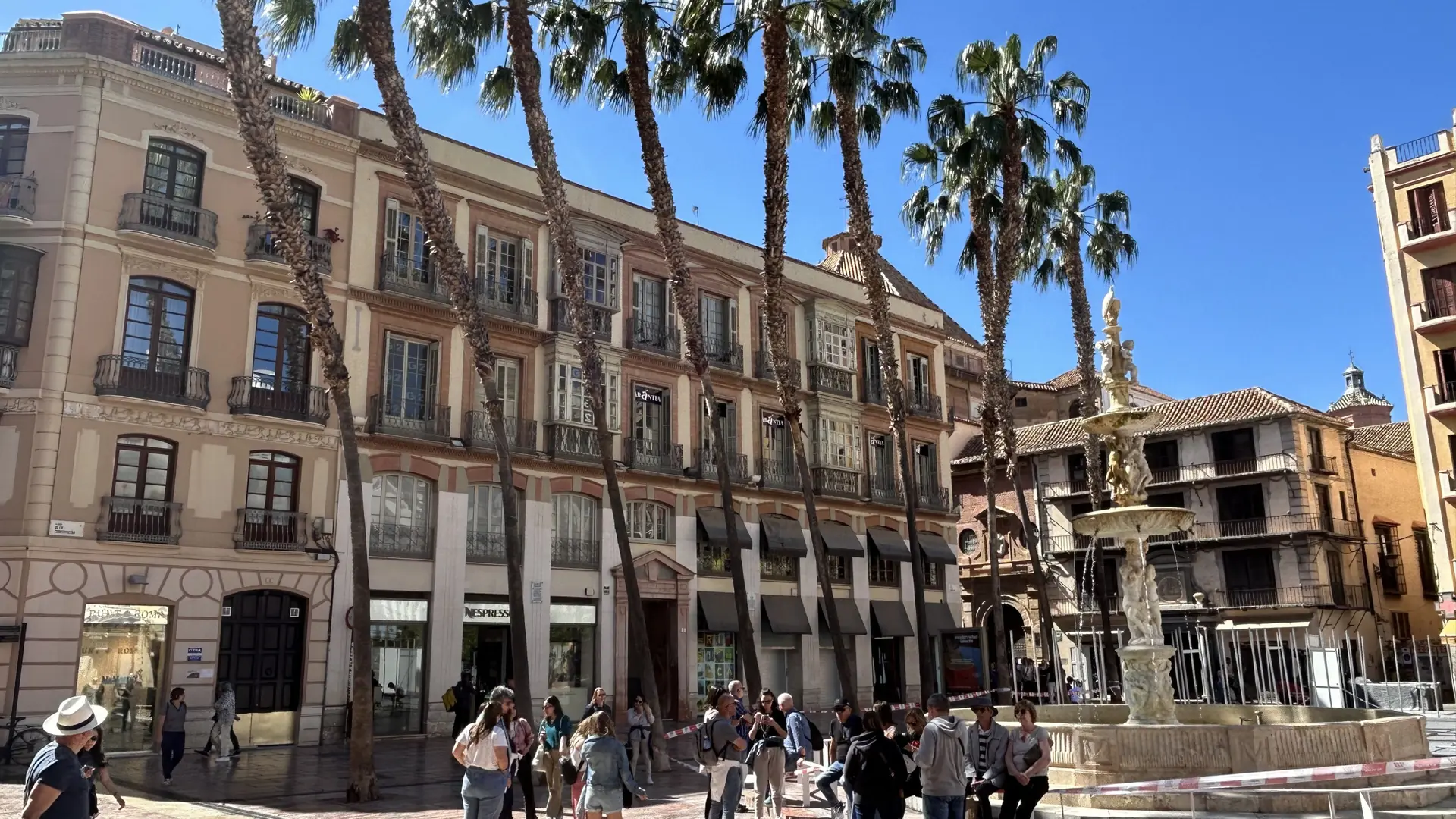 Fuente de Génova and palm trees in Málaga’s Plaza de la Constitución