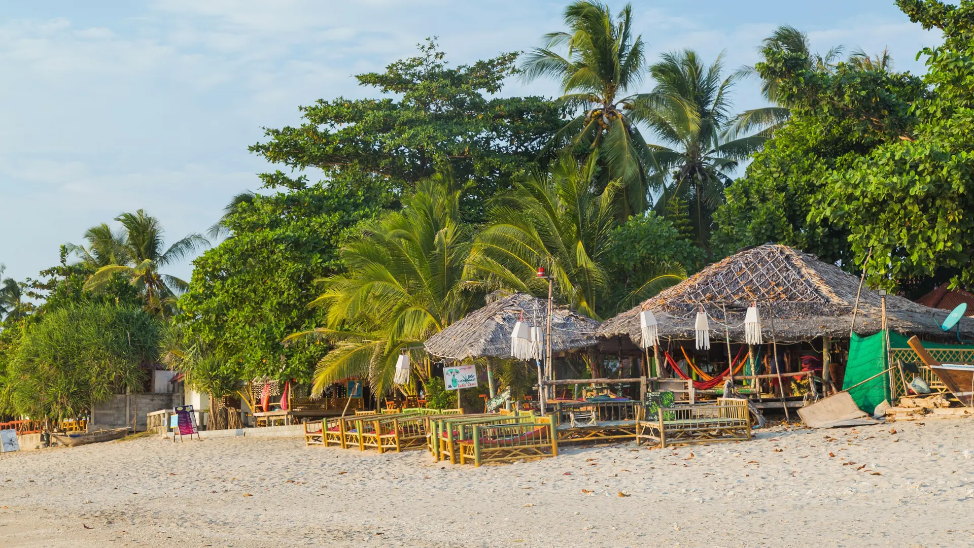 Wooden waterfront buildings and island greenery on Koh Lanta