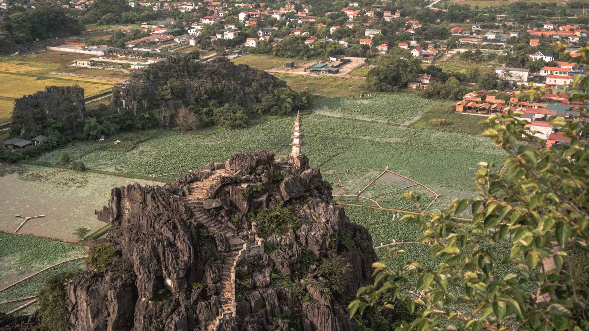 A Hang Mua hilltop tower above the wider Ninh Binh countryside, not the urban station area