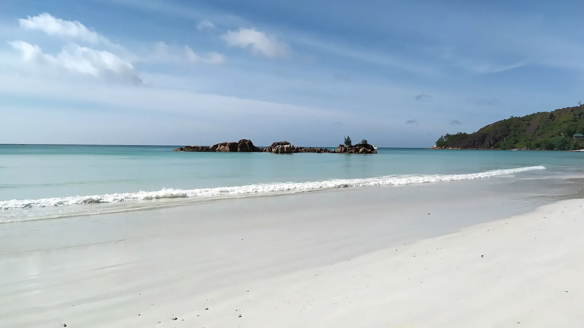 White sand and blue sea at Anse Volbert on Praslin