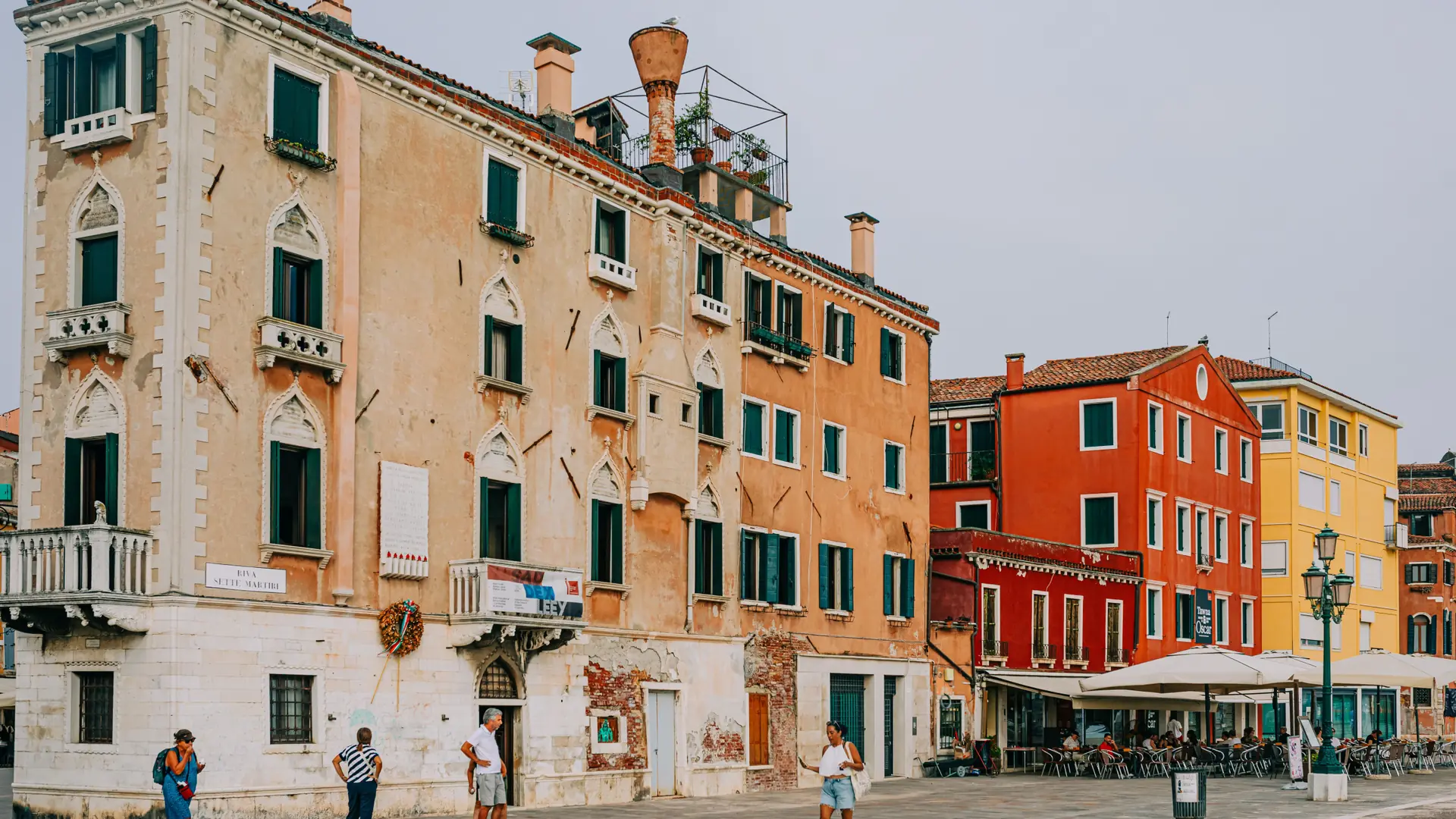 the Riva dei Sette Martiri waterfront in Castello, Venice, with pastel and terracotta façades