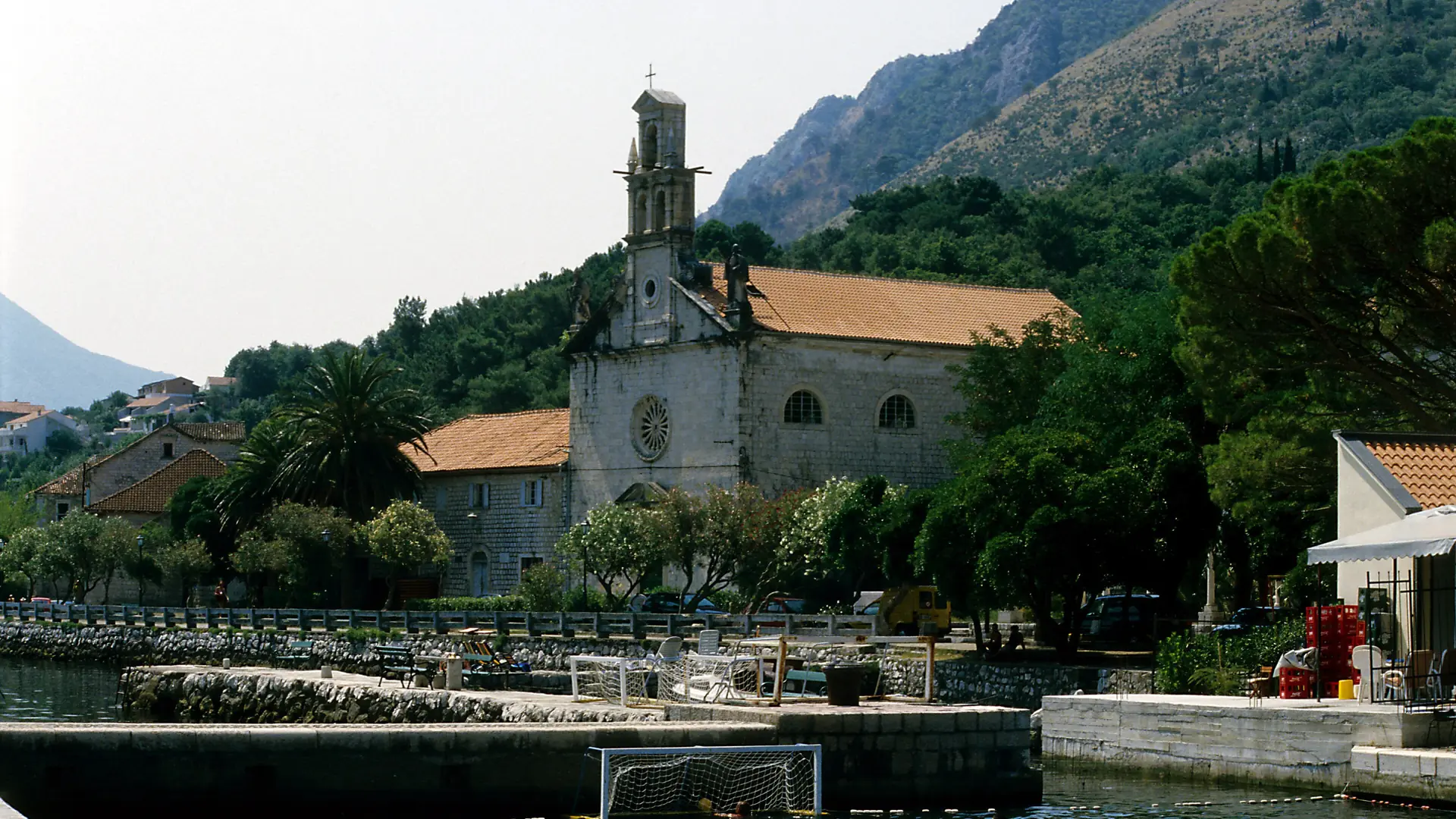St Nicholas church above the swimming waterfront in Prčanj in daylight