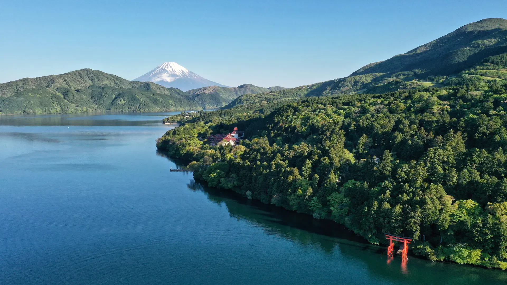 Mount Fuji beyond Lake Ashi and the wooded shoreline of Hakone Shrine