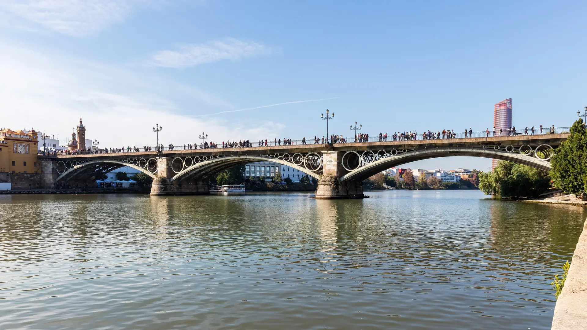 Puente de Isabel II over the Guadalquivir, with Triana’s chapel and yellow bridgehead building