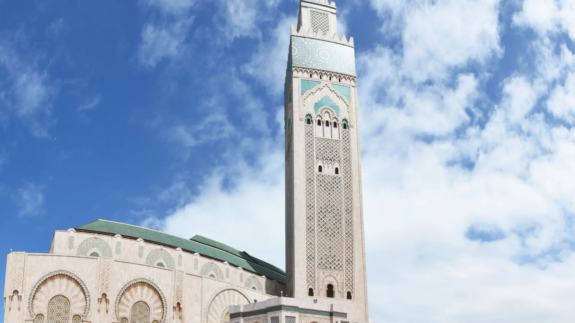 Hassan II Mosque and minaret beneath a blue Casablanca sky