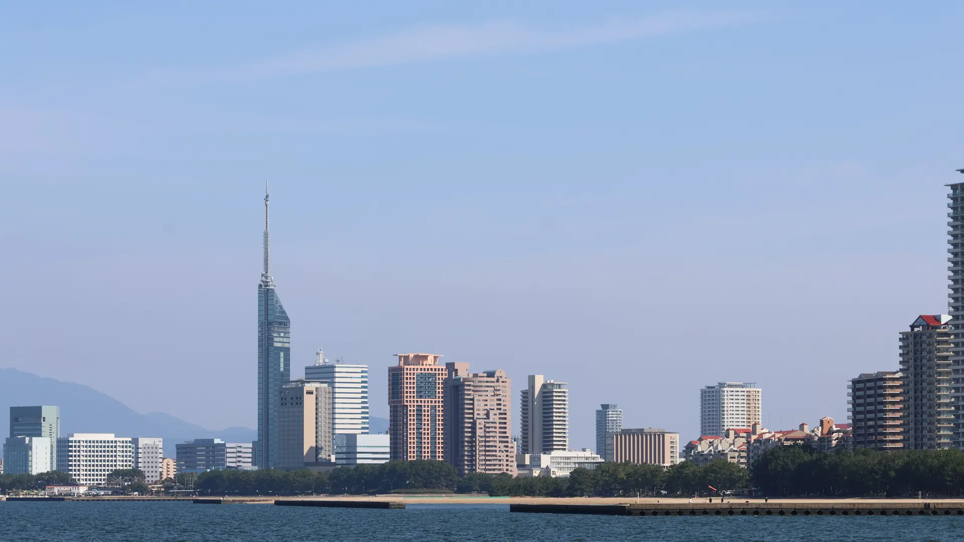 Fukuoka waterfront and modern city skyline in warm sunny weather