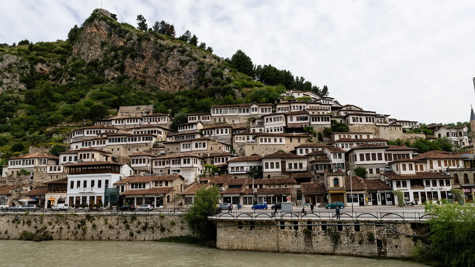 Tiers of windows on the white houses of Mangalem above the Osum river in Berat