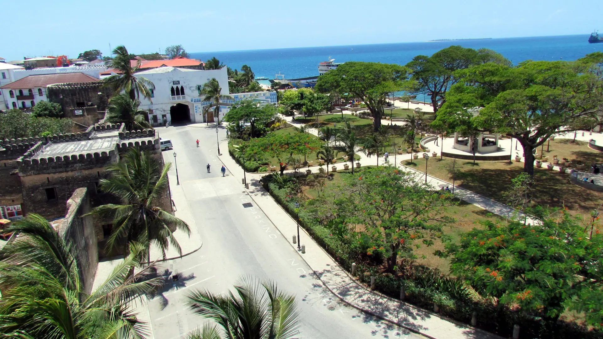 Forodhani Gardens, the Old Fort and the Stone Town seafront in bright daylight