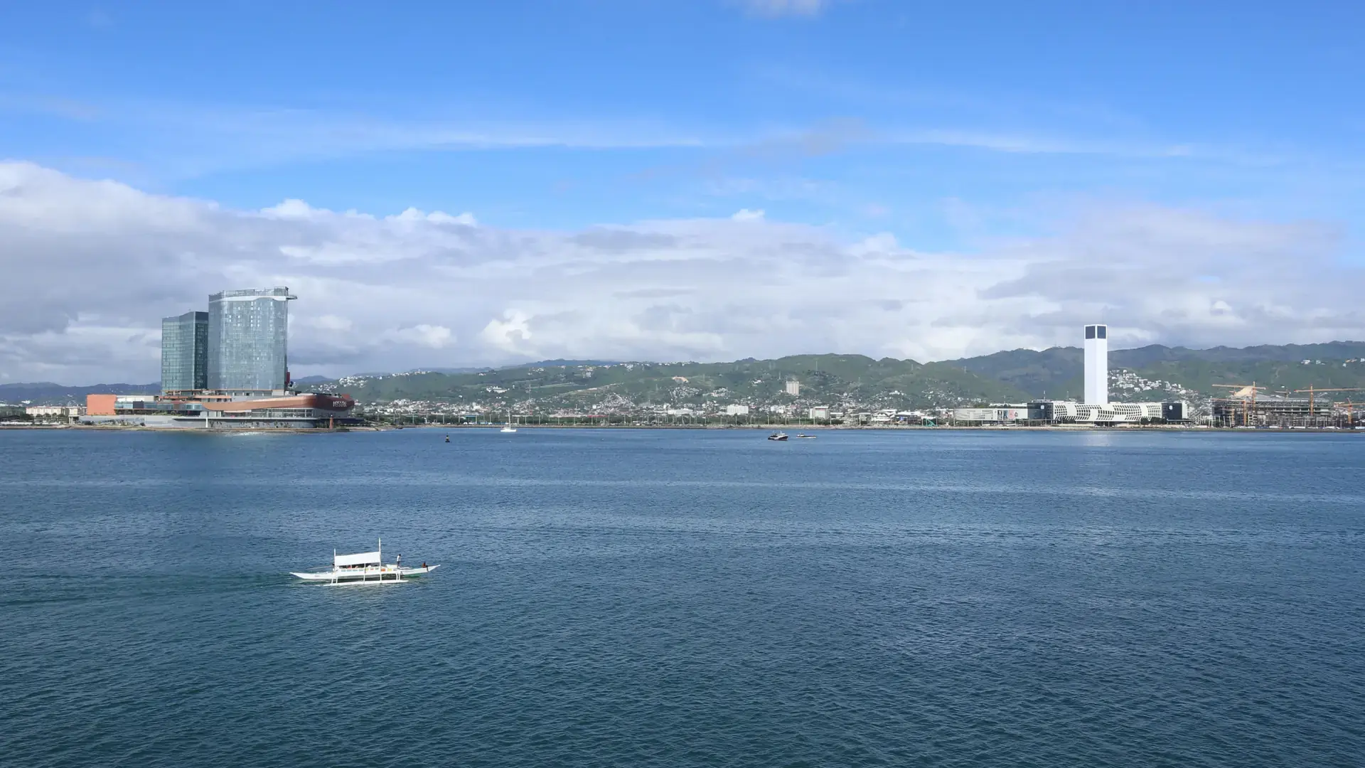 Looking across the water to the South Road Properties waterfront, Cebu City, under a blue sky
