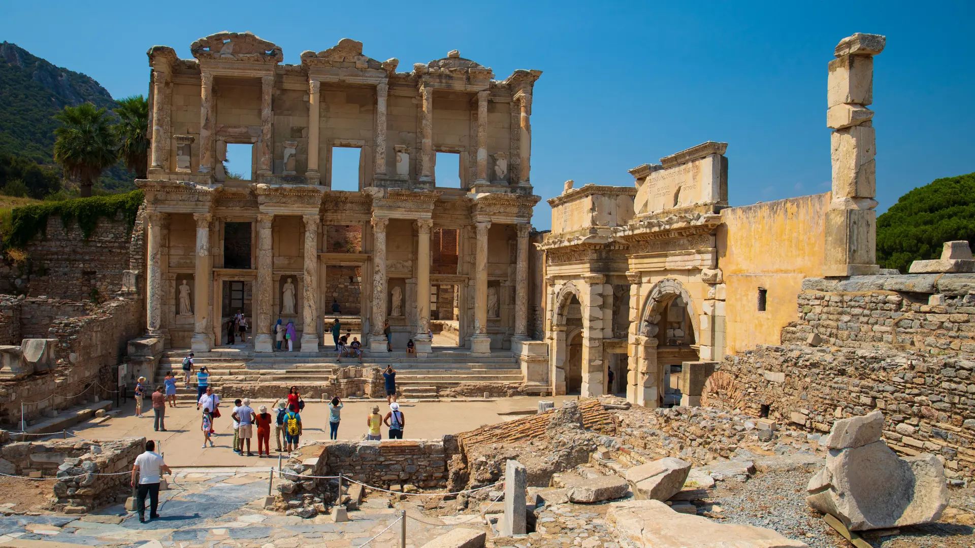 Library of Celsus and surrounding ruins at Ephesus under a blue sky