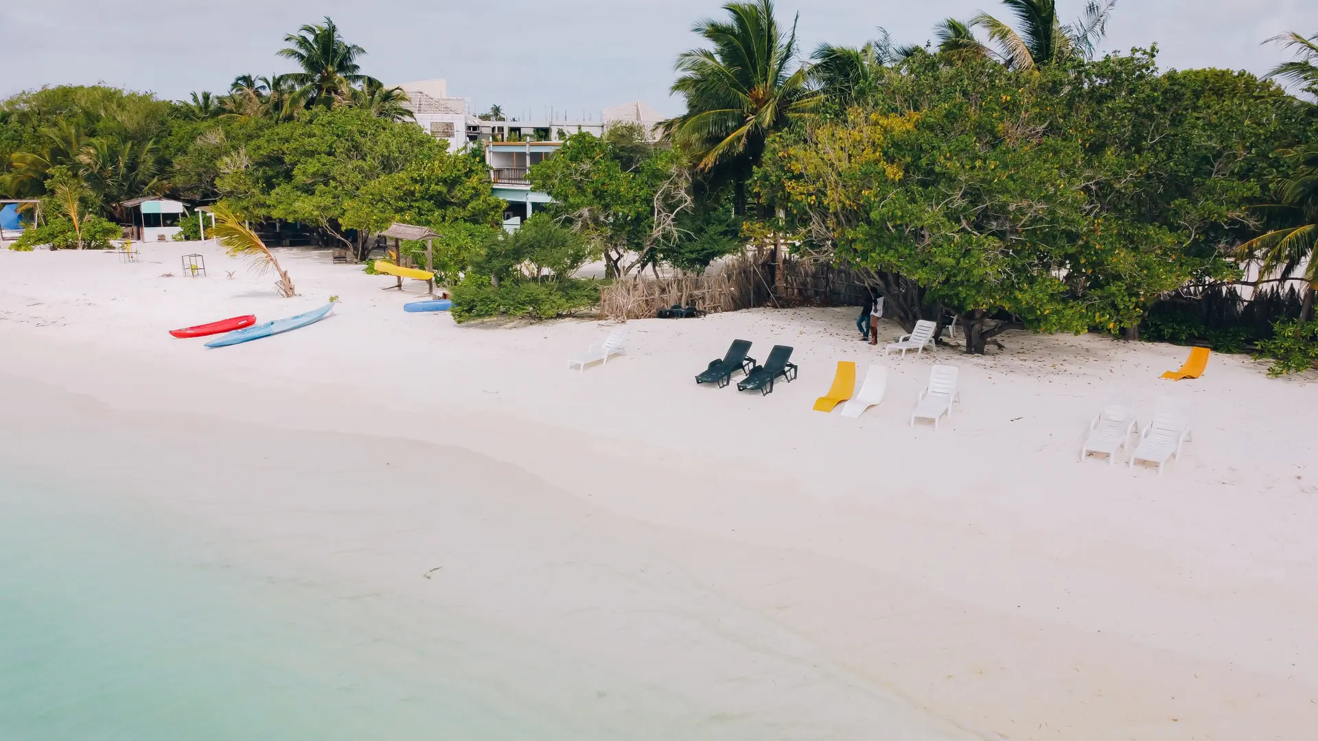 Palm-backed white beach on neighbouring Himmafushi island in North Malé Atoll