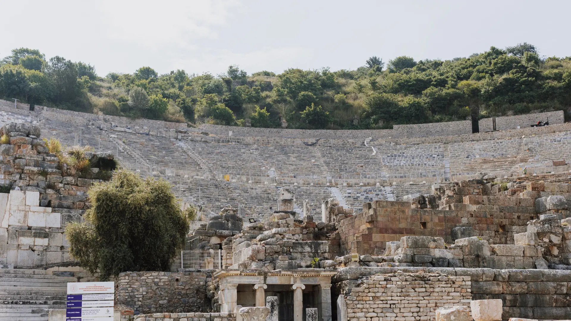 Ancient theatre at Ephesus with stone seating rising above the stage