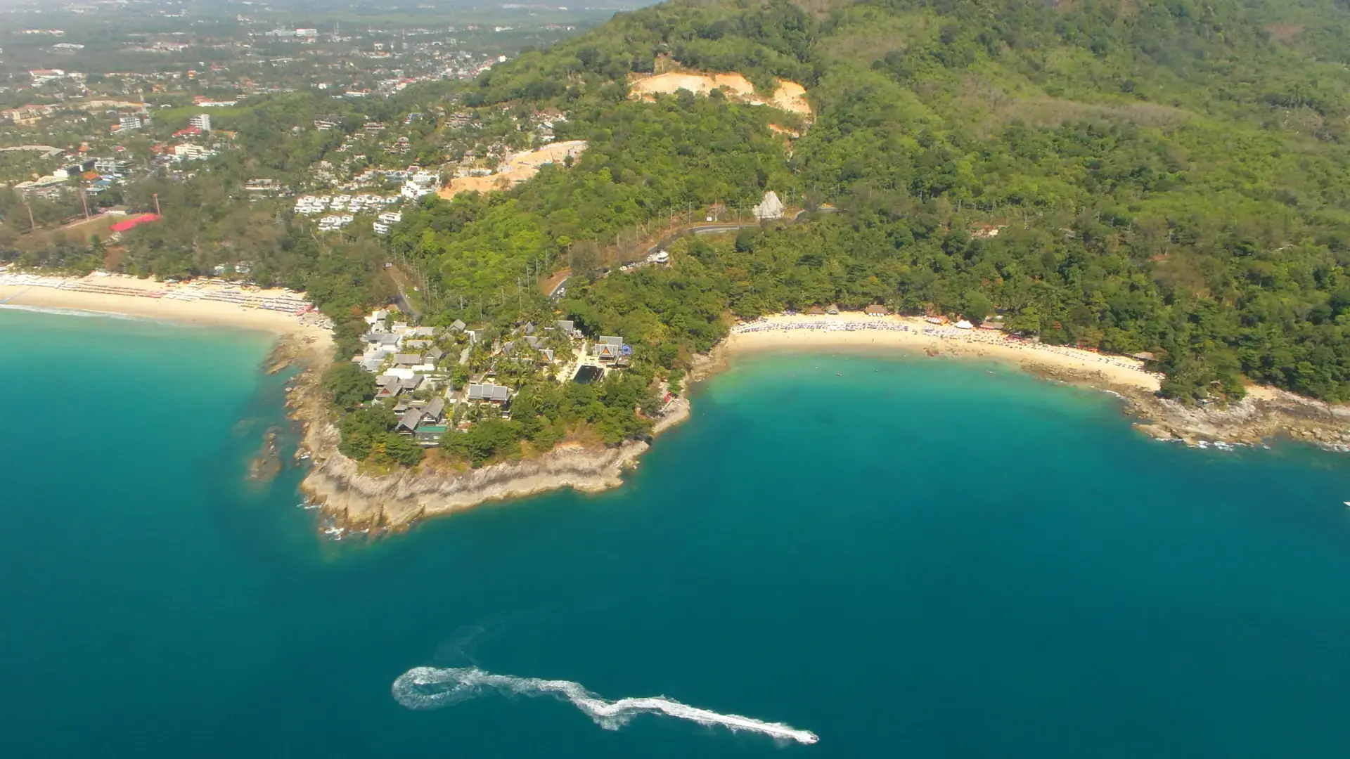 Laem Sing beach, green headland and the neighbouring Surin coast north of Kamala, a wider Phuket view