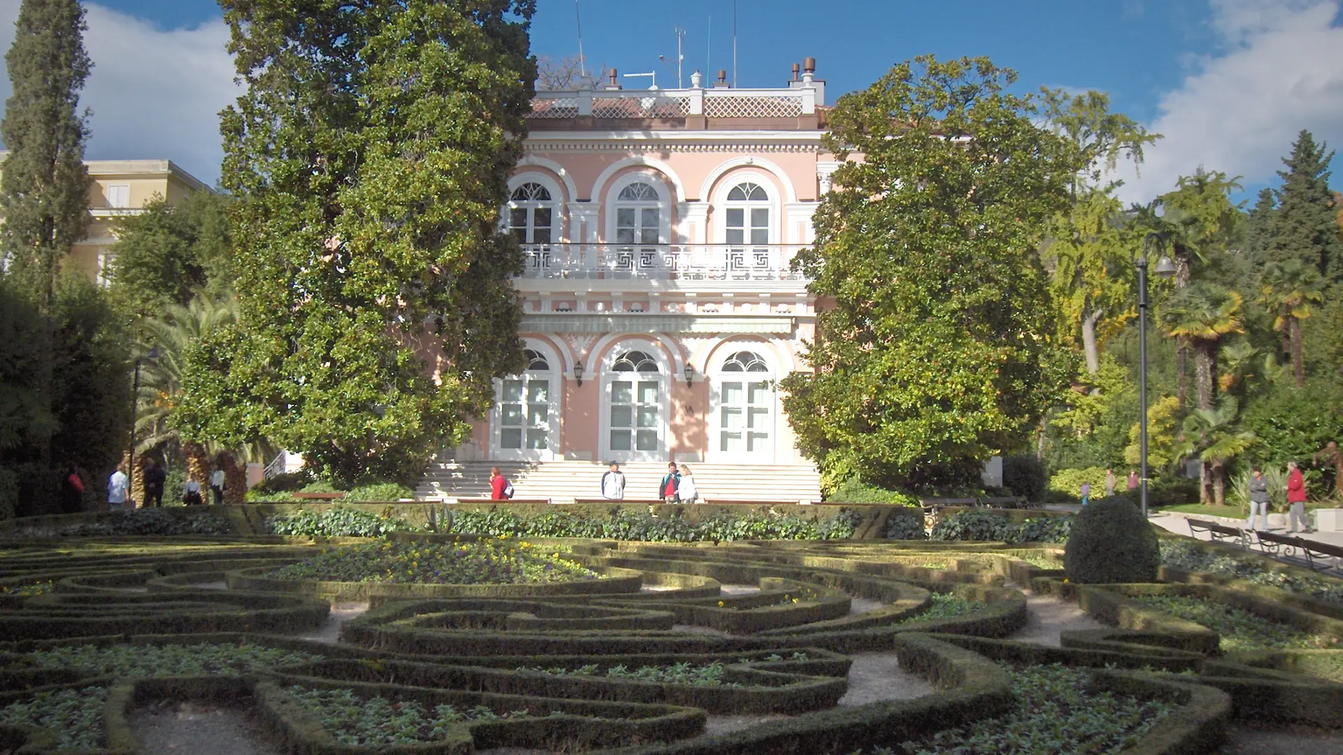 Villa Angiolina seen across the patterned gardens of Park Angiolina in Opatija