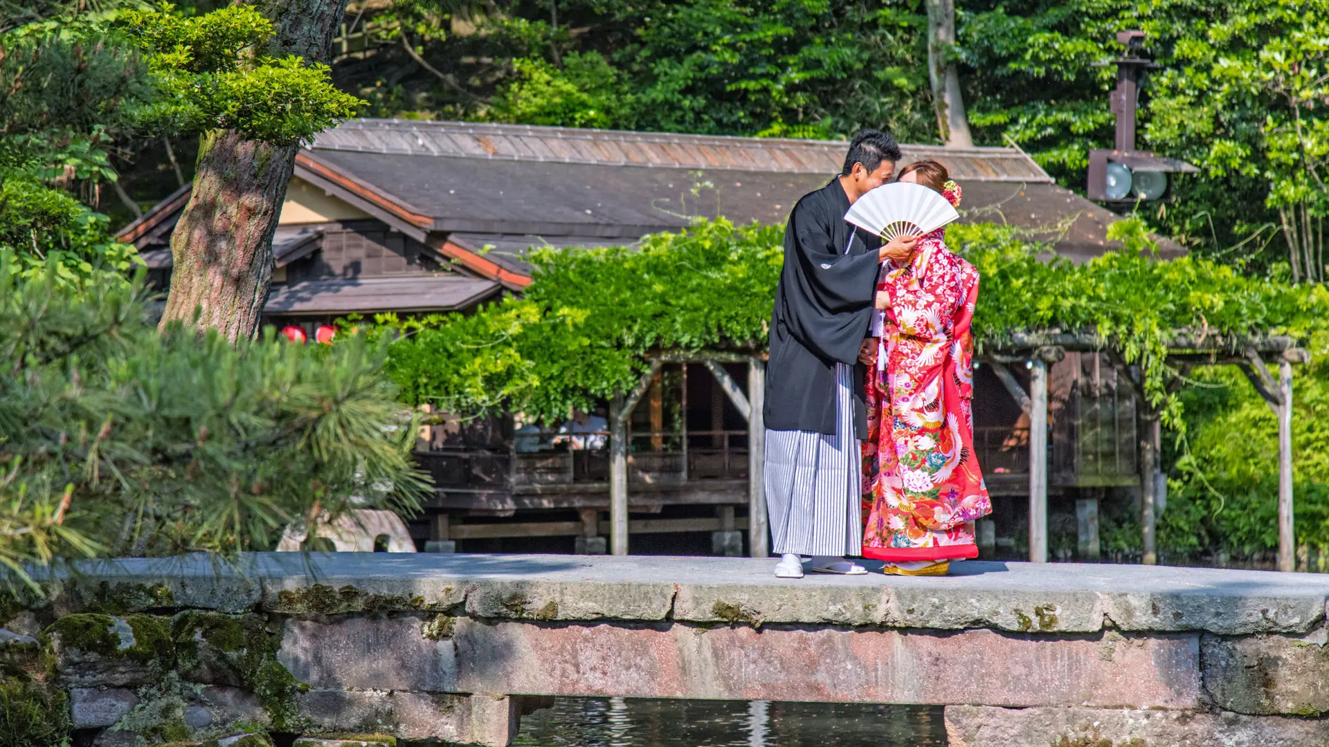 A couple beneath lanterns in Kyoto’s preserved Higashiyama lanes