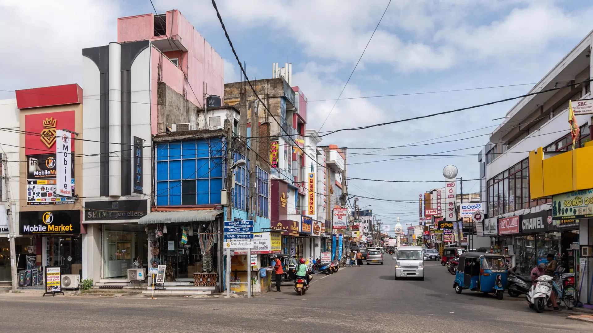 Shopfronts and traffic along Greens Road in central Negombo