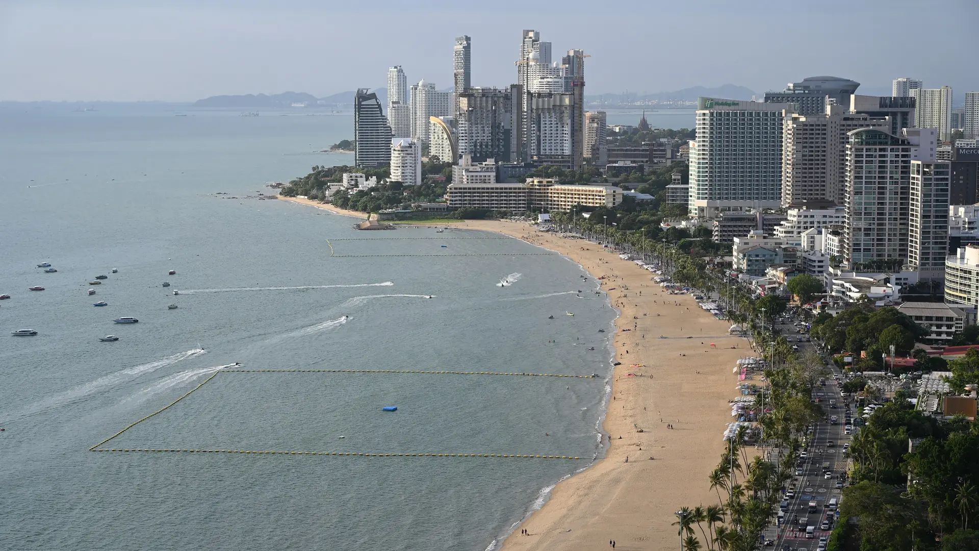Pattaya's long curving beach and high-rise skyline seen from above