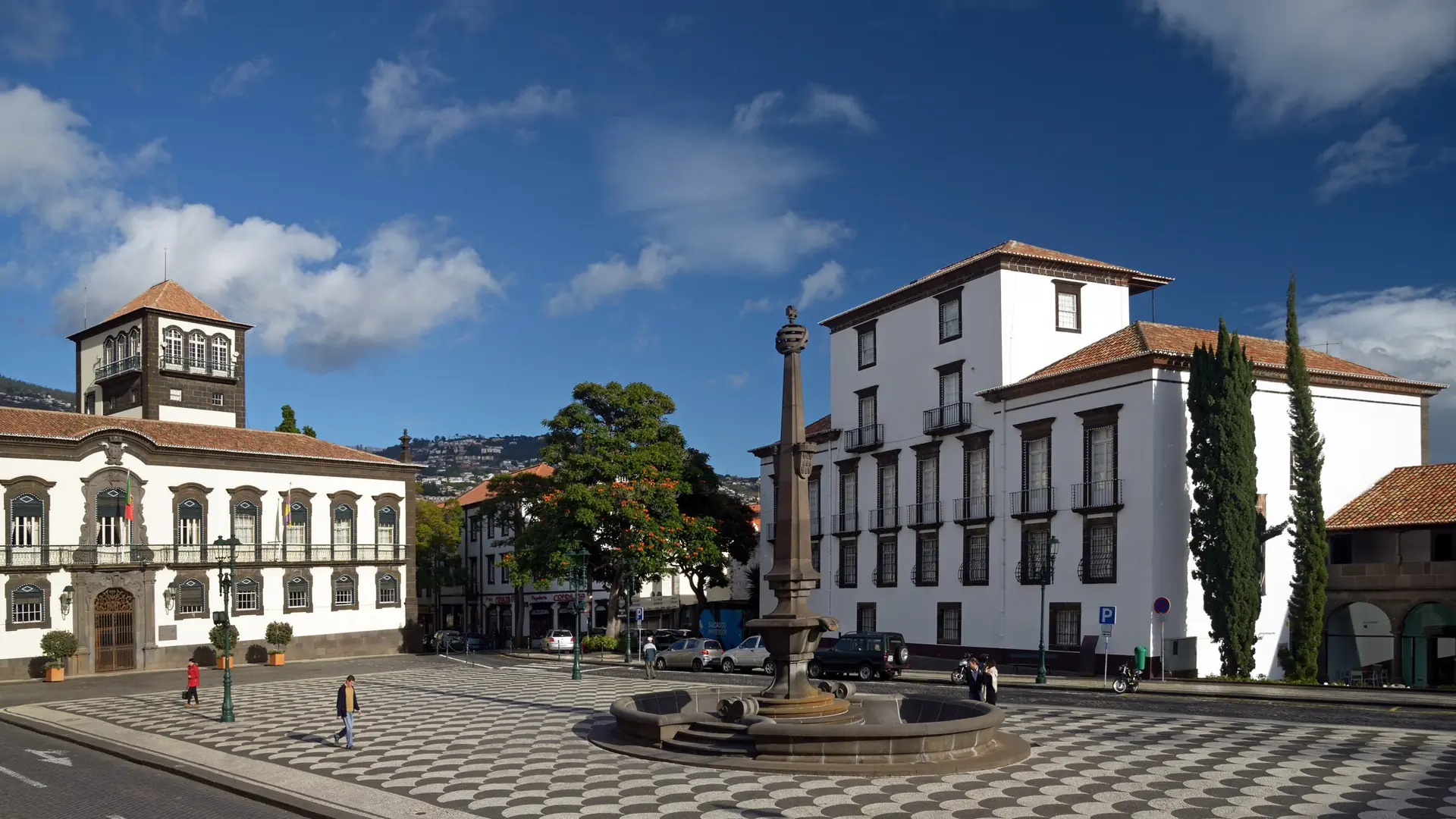 Fountain, patterned paving and historic buildings in Funchal’s Praça do Município