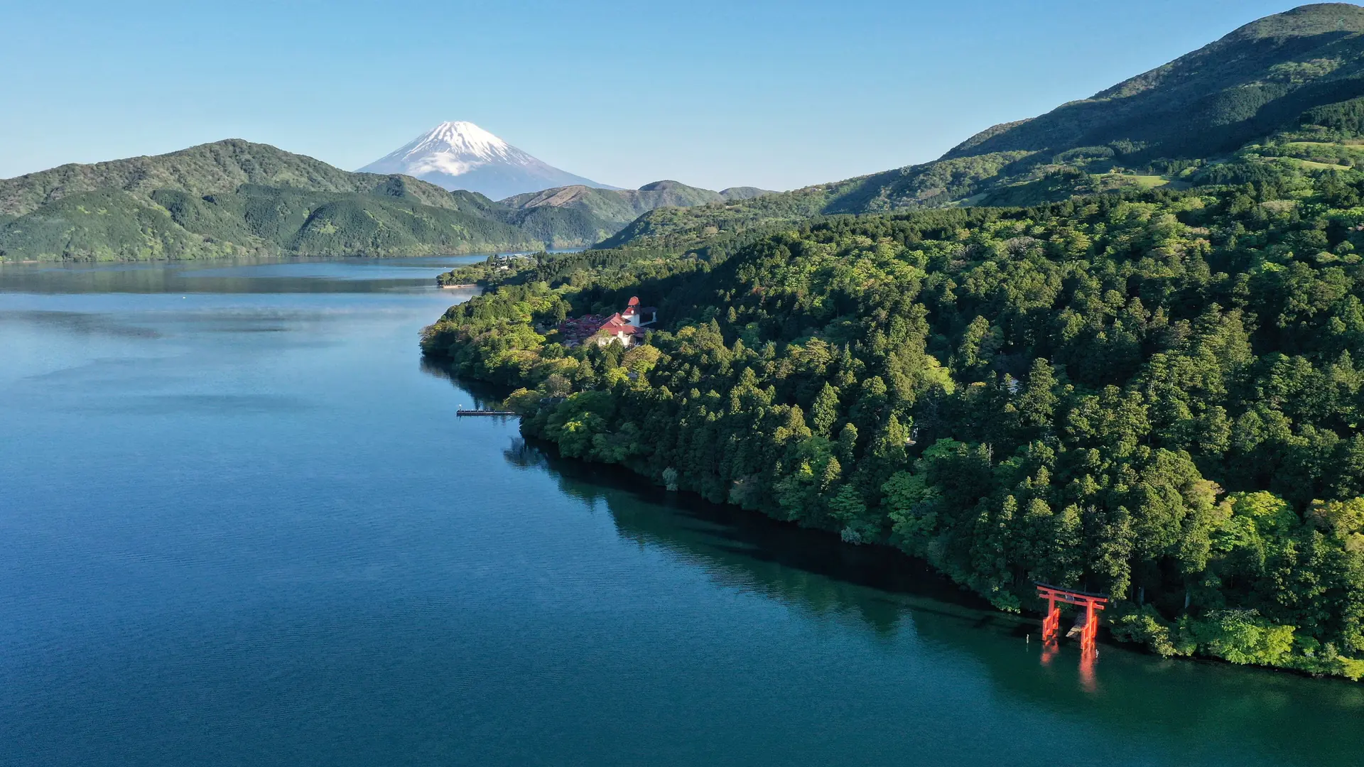 Mount Fuji above Lake Ashi, with Hakone Shrine’s red torii on the wooded shore