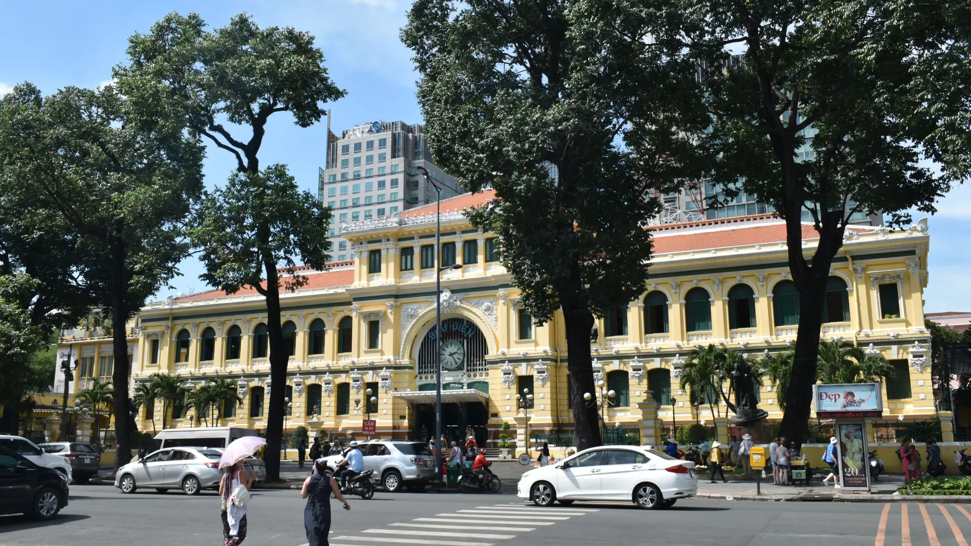 Yellow Saigon Central Post Office facade with its Vietnamese inscription visible