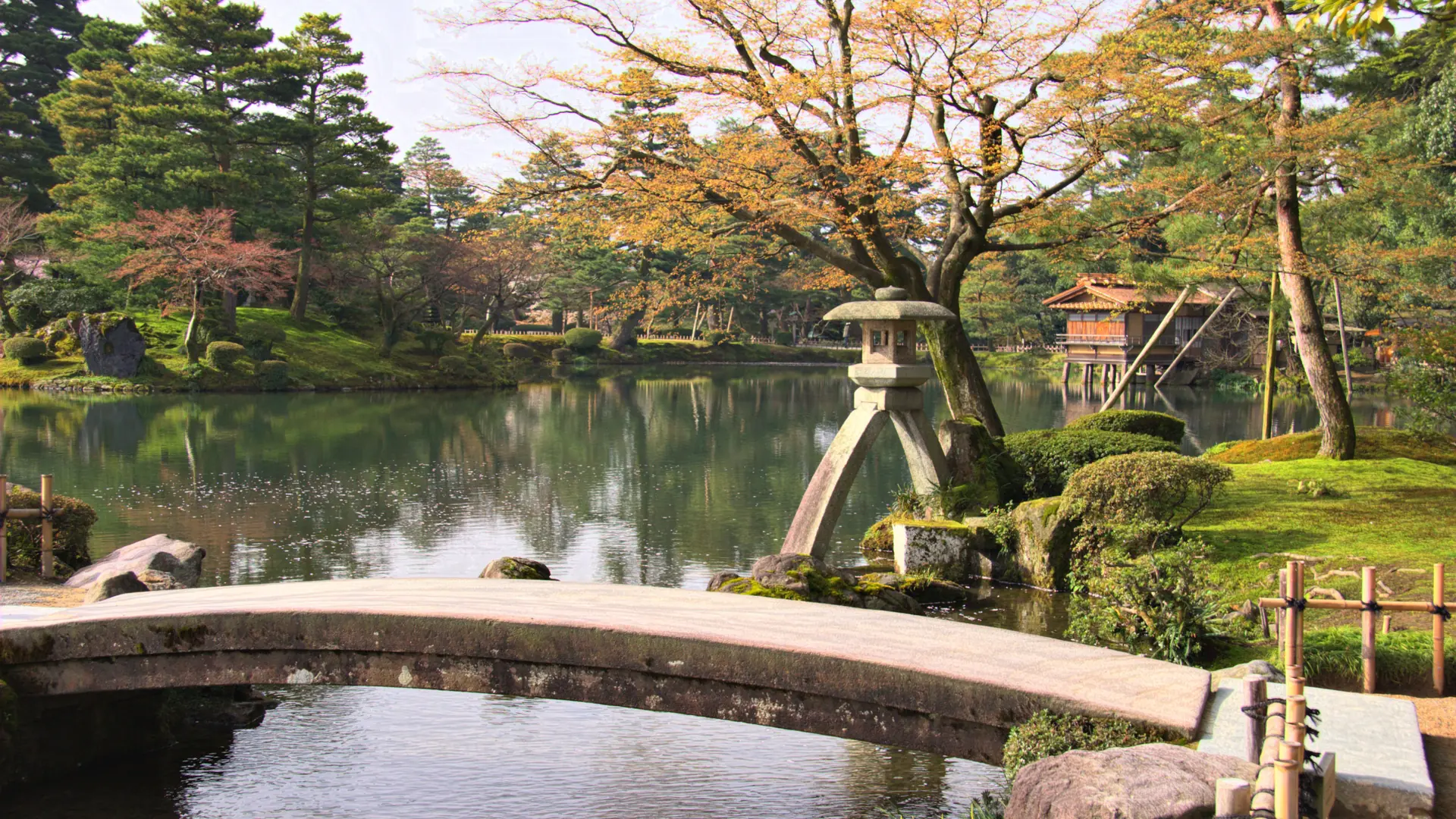 Kenrokuen Garden in Kanazawa glowing green beneath a bright summer sky
