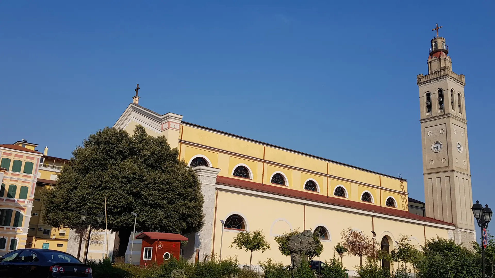 The Catholic cathedral and its bell tower in central Shkodër under a deep blue sky