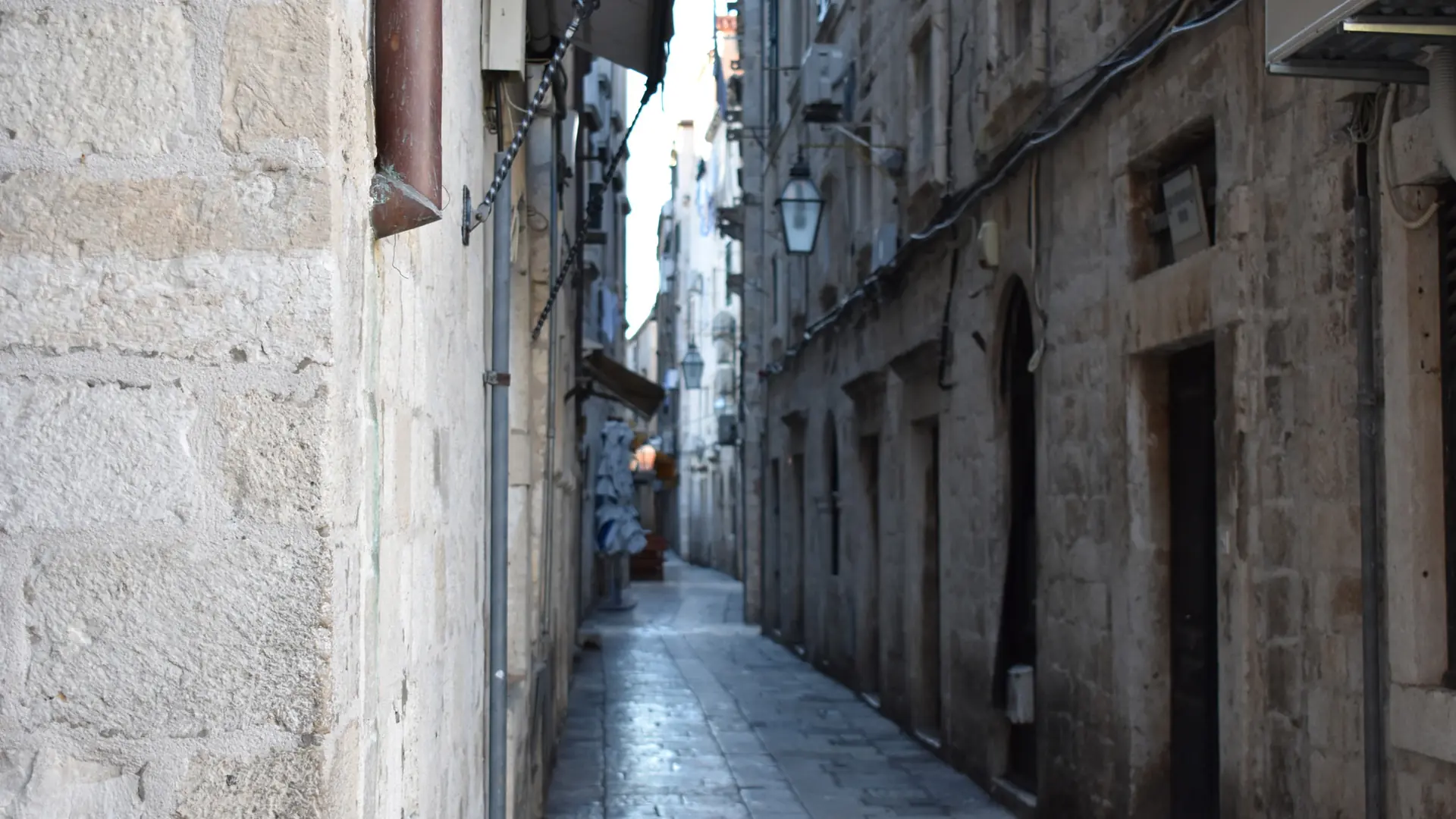 Narrow limestone lane and warm stone façades in Dubrovnik Old Town