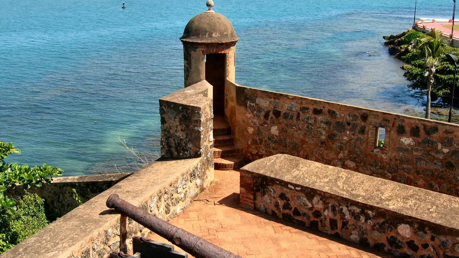 Sunlit stone ramparts of Fortaleza San Felipe above the sea in Puerto Plata