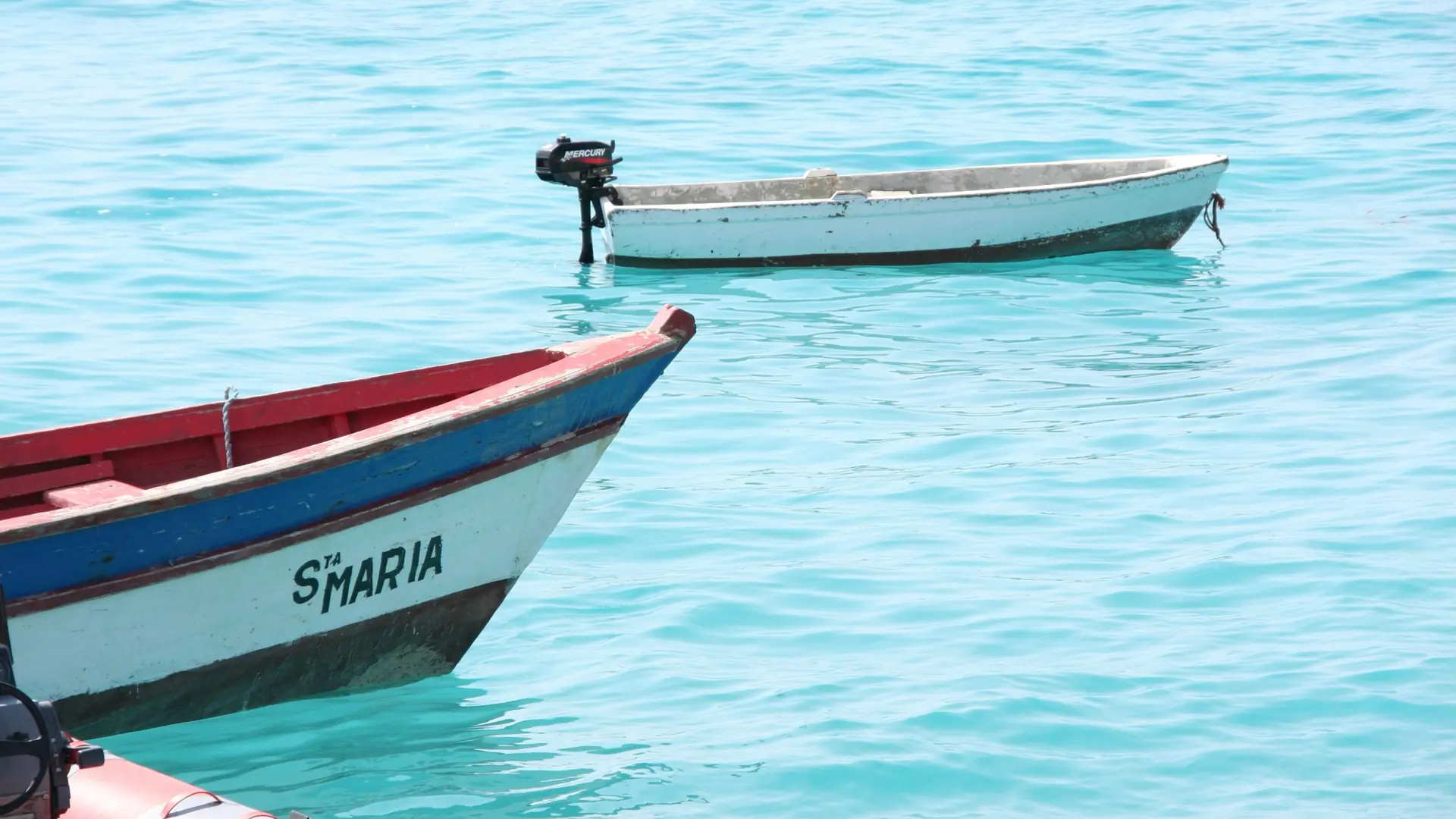 Fishing boats on turquoise water off Santa Maria on Sal island