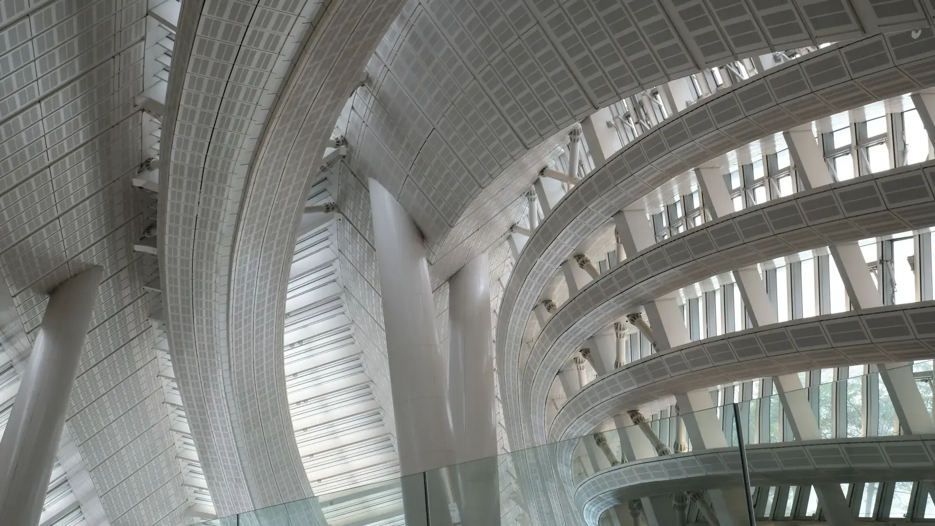 Kyoto Station's glass-and-steel atrium glowing in clear daylight