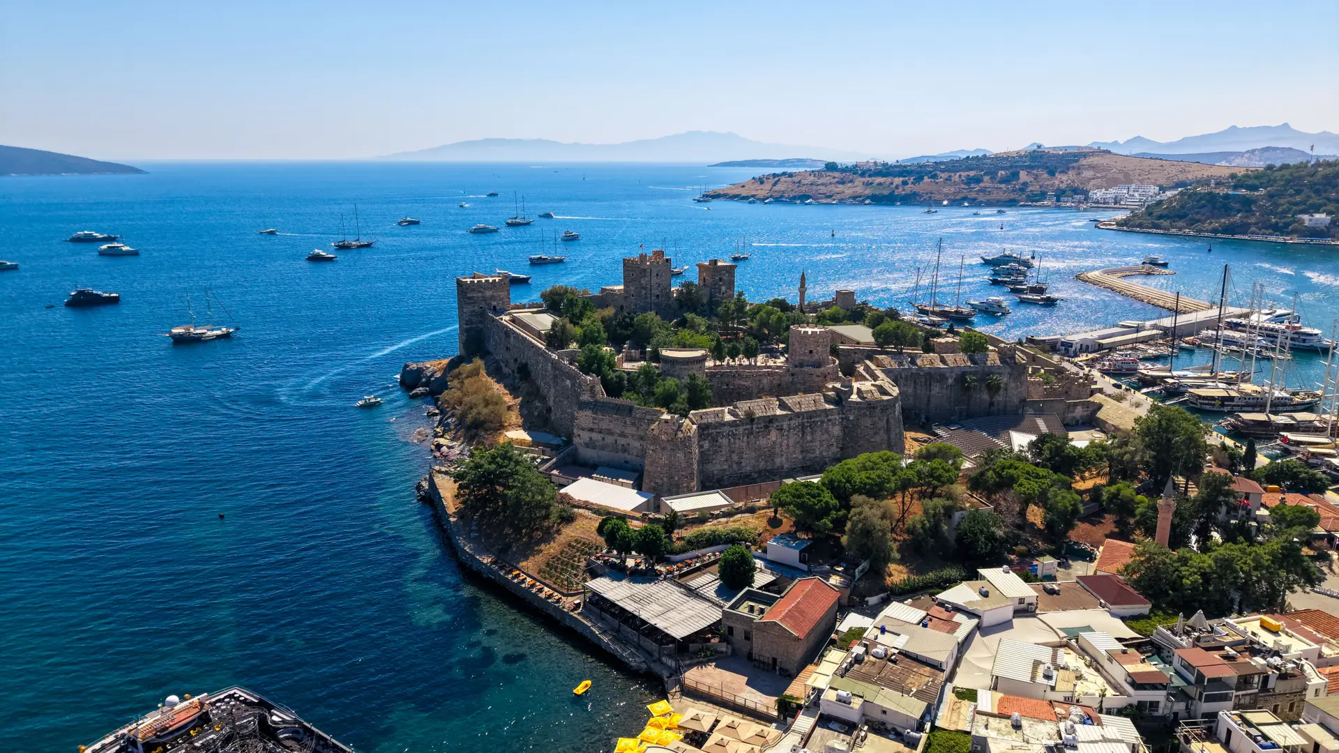 Bodrum Castle and harbour boats under clear Aegean sunlight