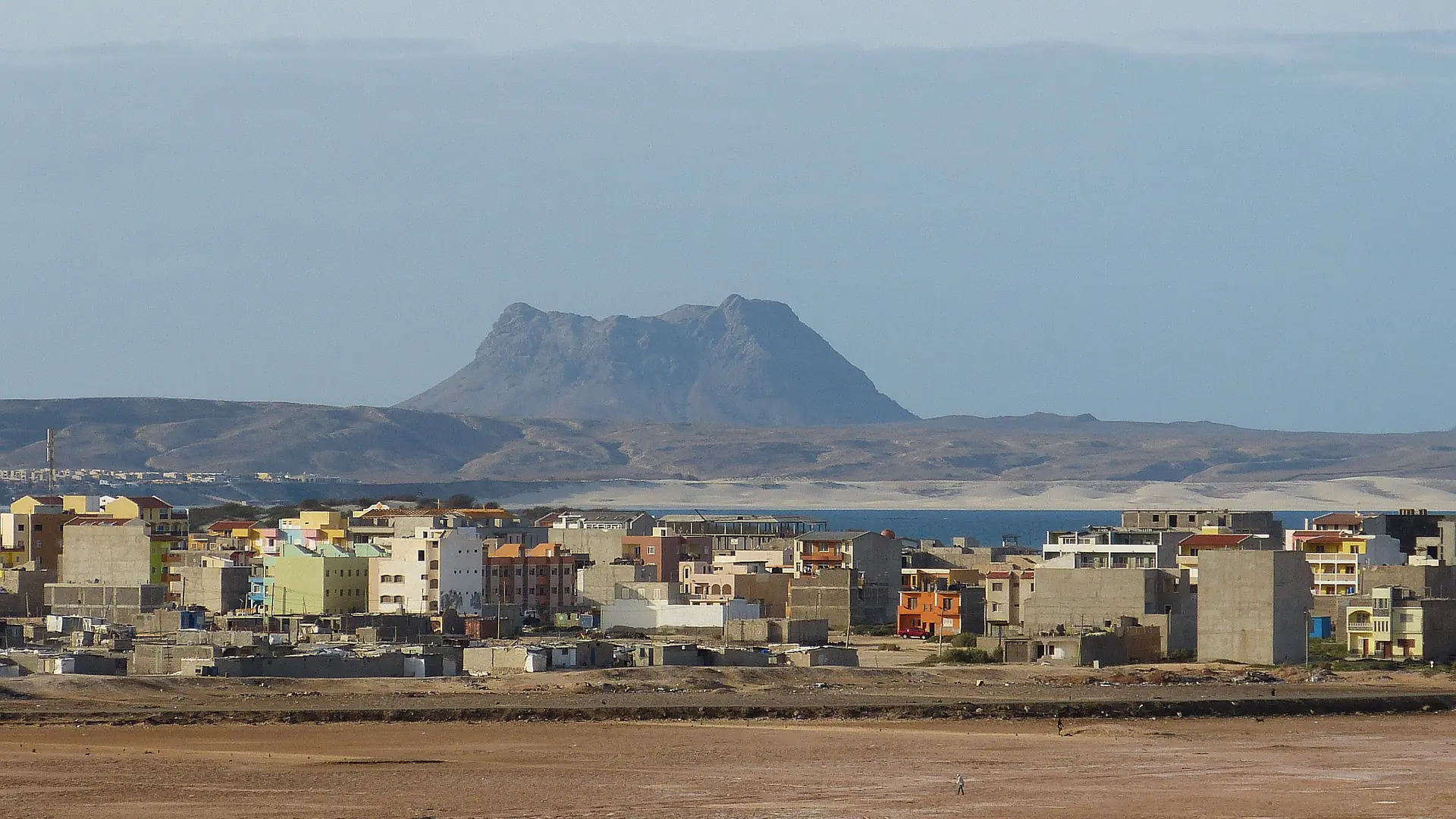 Sunlit Sal Rei town and Rocha Estância mountain on Boa Vista