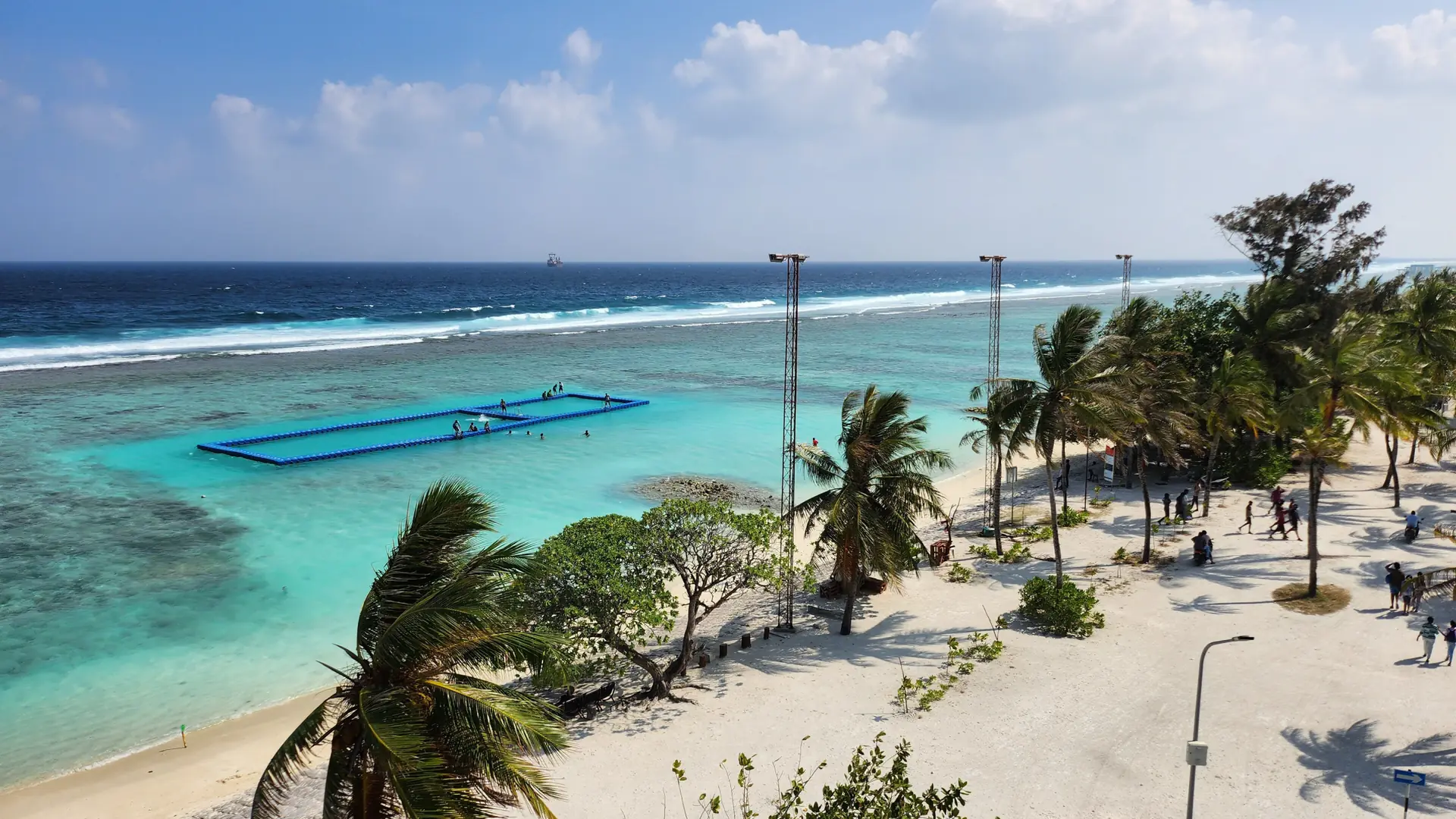 Sunlit Hulhumalé shoreline and neighbourhood near Malé airport