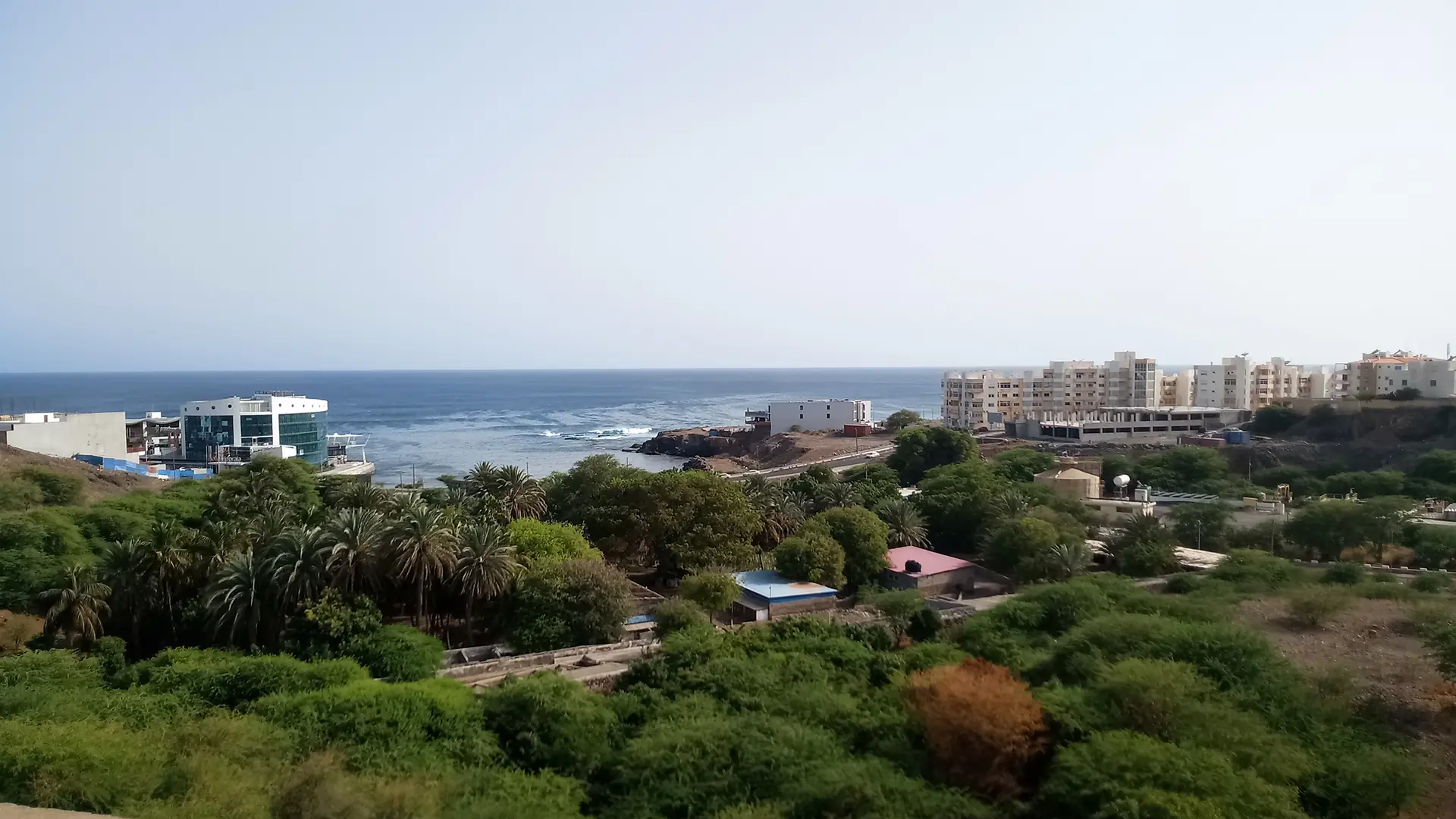 Southern Praia coast and green hillside near Quebra Canela