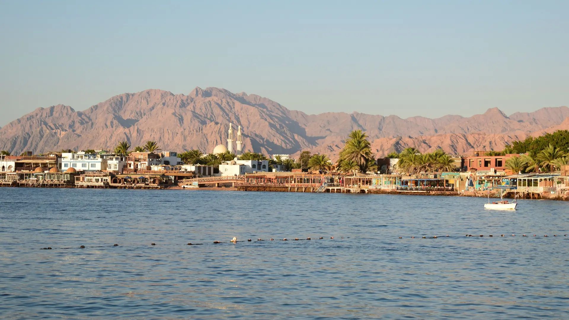 Sunlit seafront and Sinai mountains at Dahab on the Gulf of Aqaba
