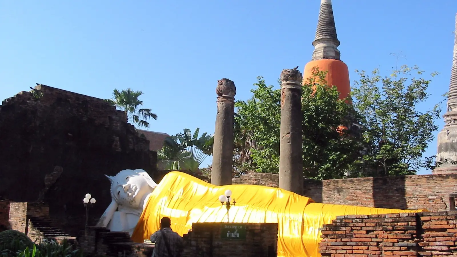 Reclining Buddha beneath a blue sky at Wat Yai Chai Mongkon in wider Ayutthaya, rather than Han Tra