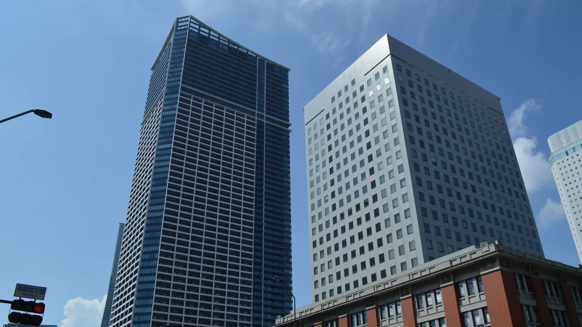 modern Yokohama skyscrapers rising into a vivid blue sky in Minato Mirai