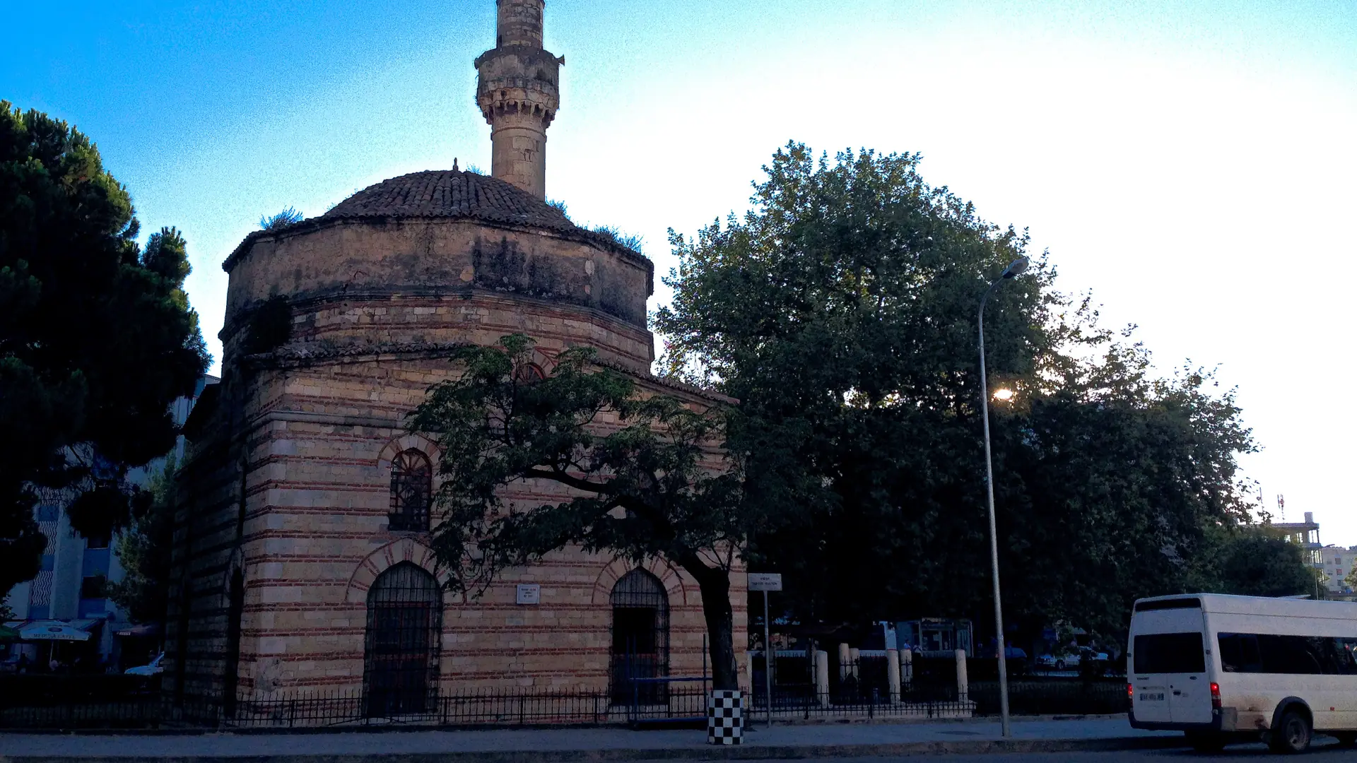 The stone Muradie Mosque and its minaret in central Vlorë on a sunny day