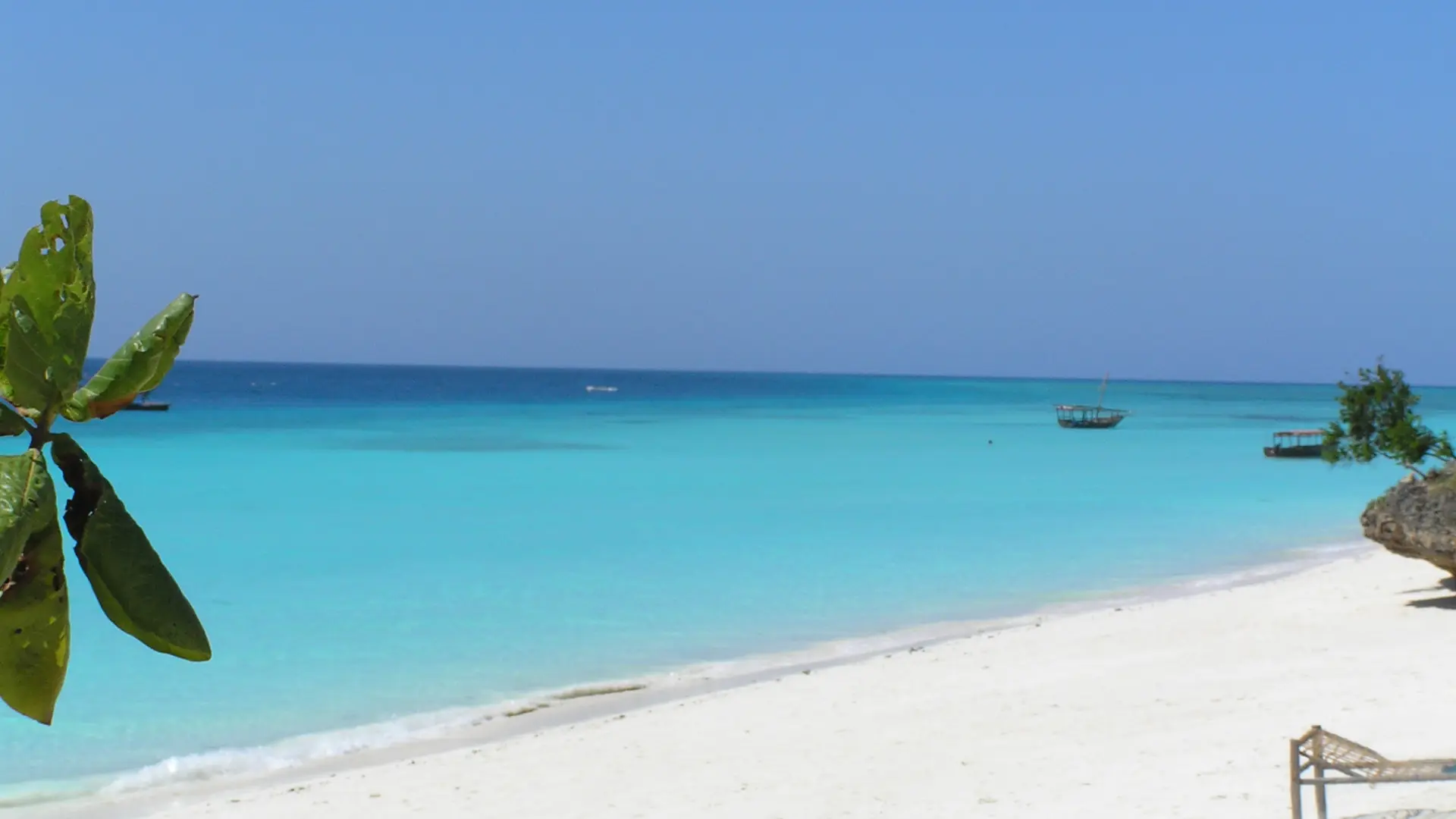 White Nungwi beach and turquoise water under a clear sky